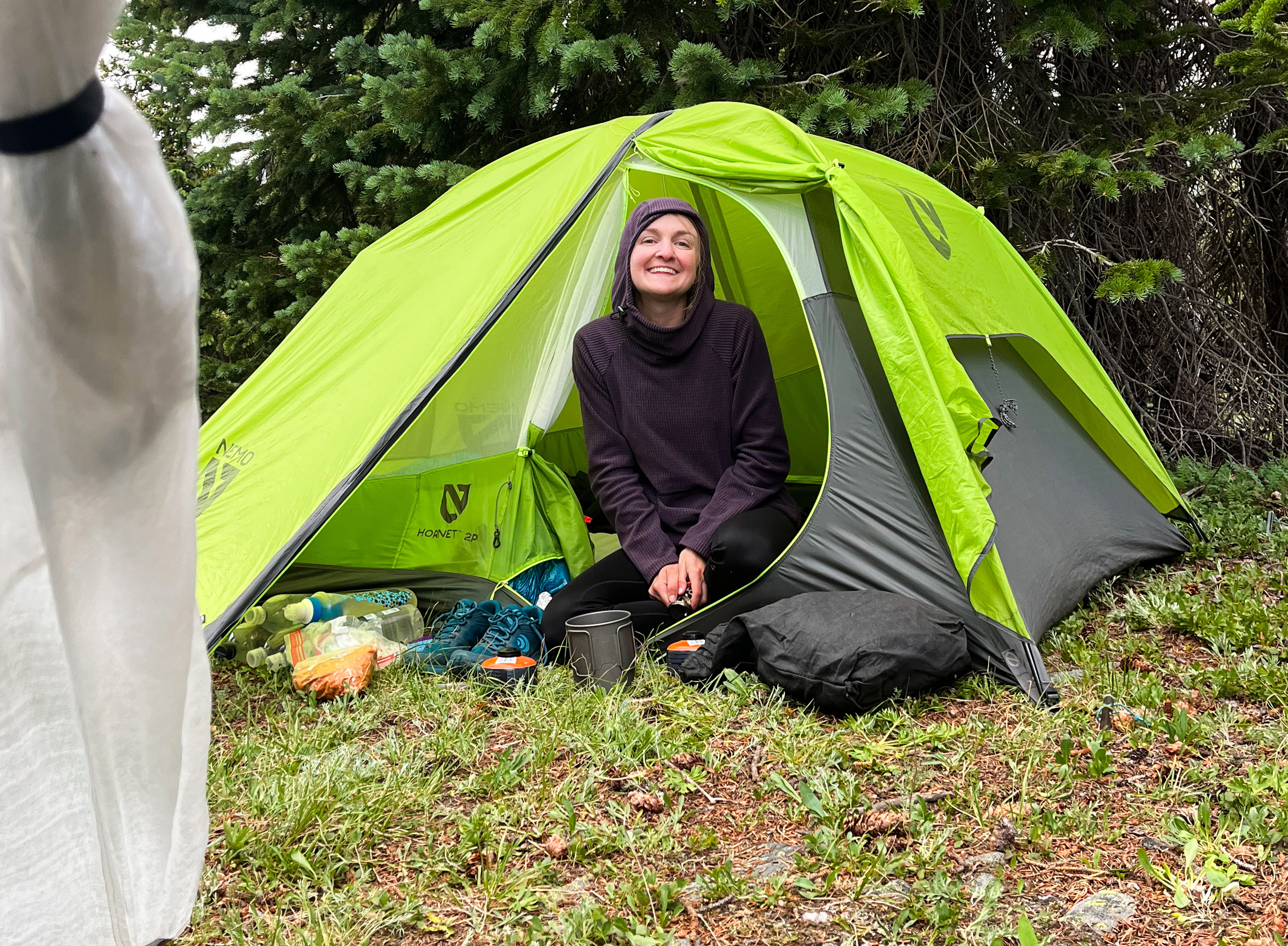 Kyla Pearce sits in her tent just below Georgia Pass along the Colorado Trail on Aug. 8. (Ariella Nardizzi, Special to The Gazette)