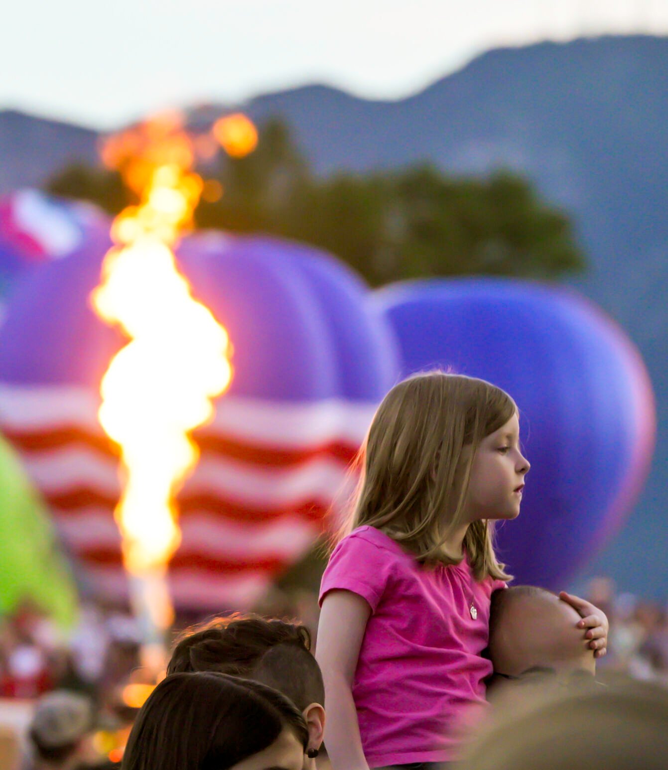 A seat above the crowd during a balloon glow evening of the Colorado Springs Labor Day Lift Off on Sunday, Sept. 1, 2024.
