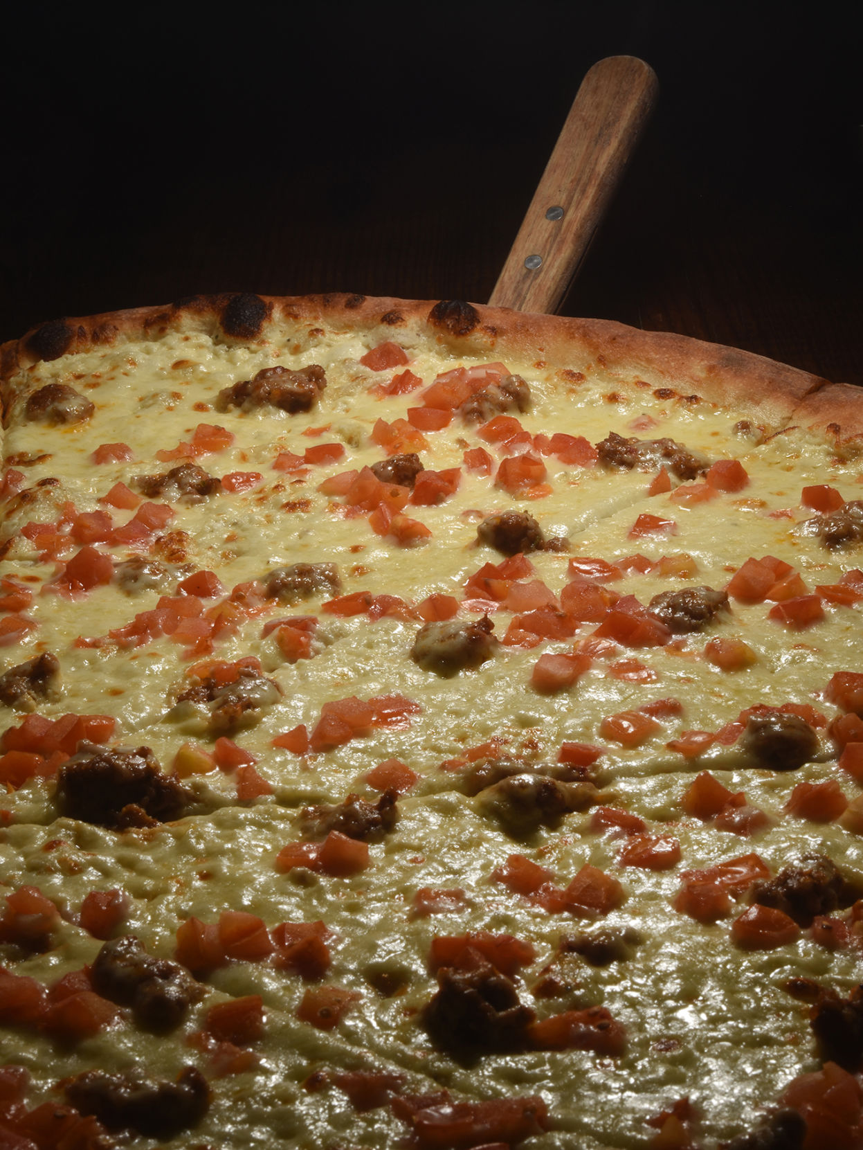 Fat Sully’s Pizza (Located at 528 S. Tejon) “Sausage and Tomato Pizza with White Sauce” Thursday March 28, 2019. Photo by Jeff Kearney. (Jeff Kearney)