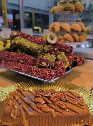 A decadent selection of baklava and pistachio-filled sweets at Reem’s Bakery, where traditional Middle Eastern desserts meet modern creations like the Dubai Chocolate Bar. (Courtesy: Reem's Bakery)