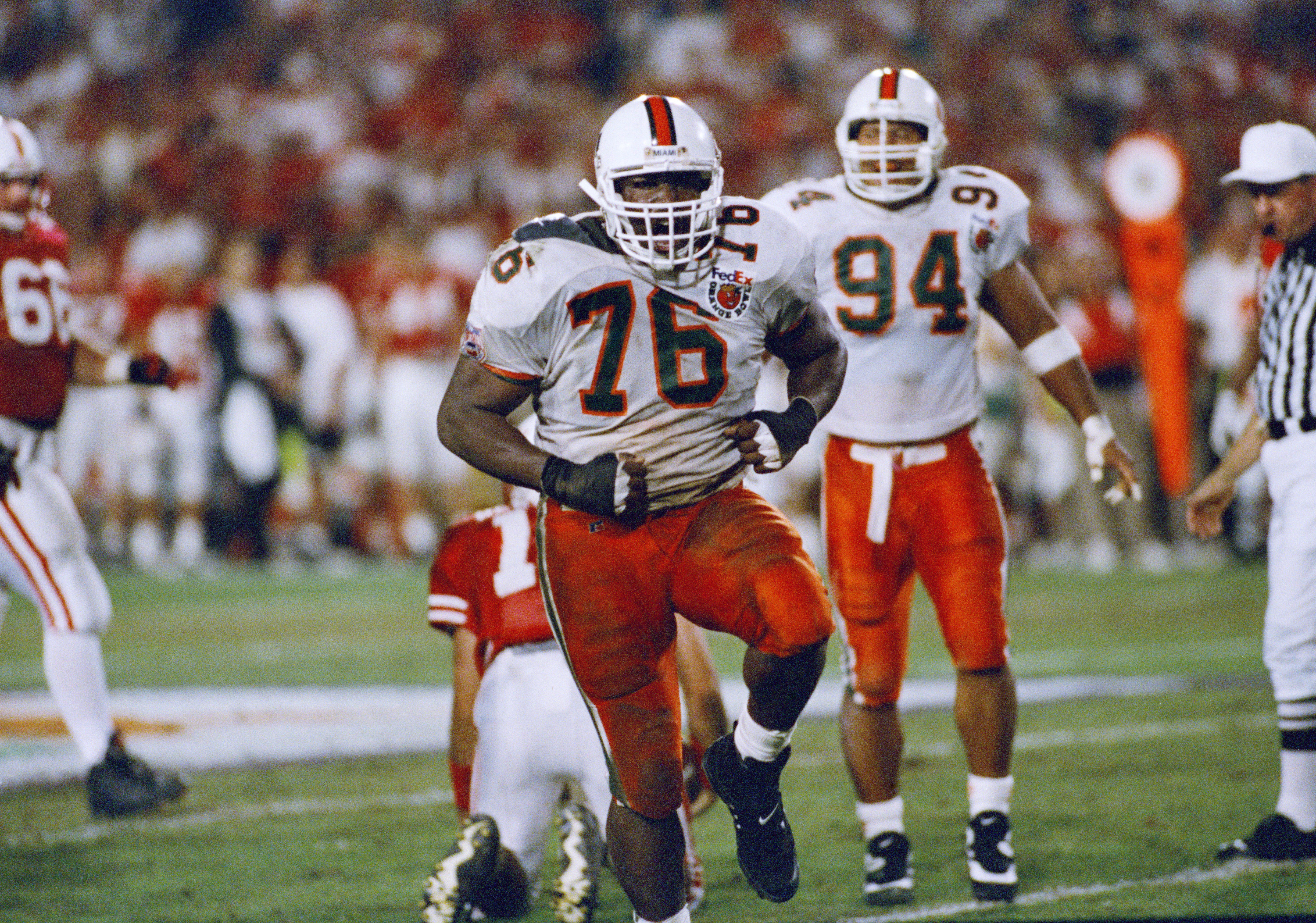 Miami's Warren Sapp (76) celebrates after sacking Nebraska quarterback Brook Berringer (18) in the second quarter during the Orange Bowl in Miami, Jan. 1, 1995. (AP Photo/Jeffrey Boan) (JEFFREY BOAN)