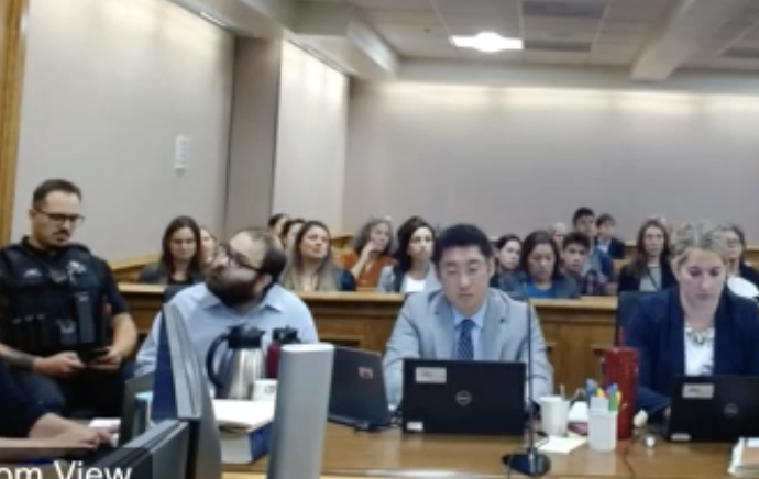 This screenshot taken Friday, Aug. 6,2024, shows Ahmad Alissa watching video footage of himself driving by a water plant 20 minutes before the Table Mesa King Soopers mass shooting on March 22,2021 that left 10 dead. (Courtesy of Colorado Judicial Livestream)