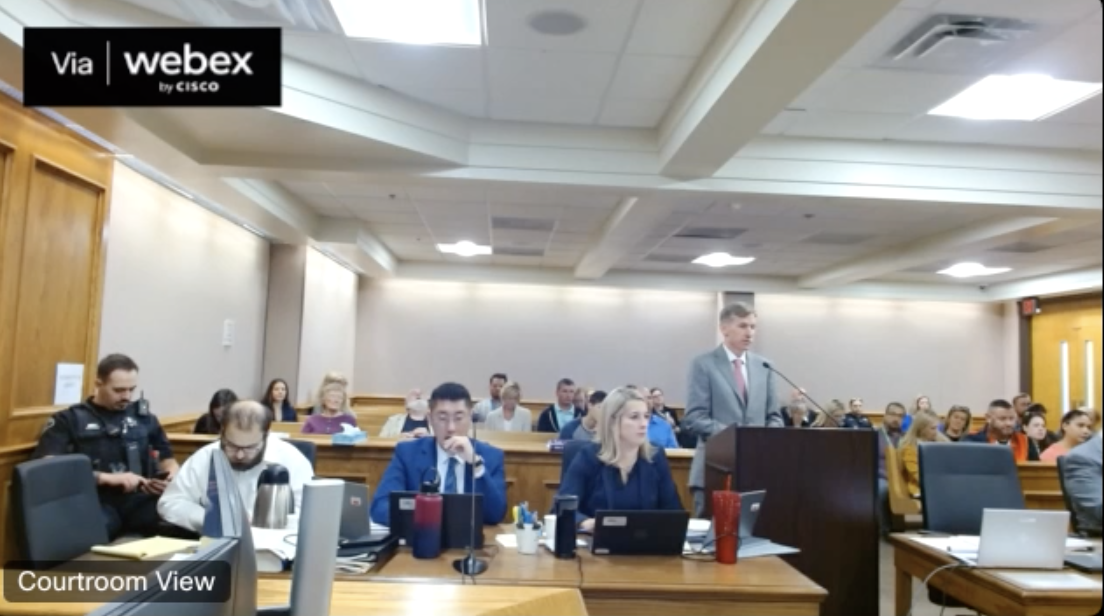Ahmad Alissa and his defense attorneys watch 20th Judicial District Attorney Michael Dougherty speak with witnesses on Friday morning, continuing the seventh day of testimony in the murder trial. (Screengrab of the 20th Judicial District's live feed via WebEx)