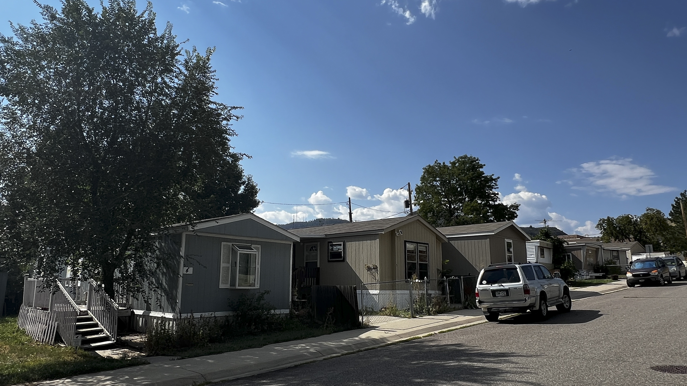 Modest yet well-loved mobile homes line the south side of 2nd Street in Golden, where residents of the Golden Hills Mobile Home Park made repeated efforts to buy their community from out-of-state investors. Now celebrating their first year as a resident-owned community, the 39-unit park faces the challenges of ownership with optimism and hope. (Deborah Grigsby)