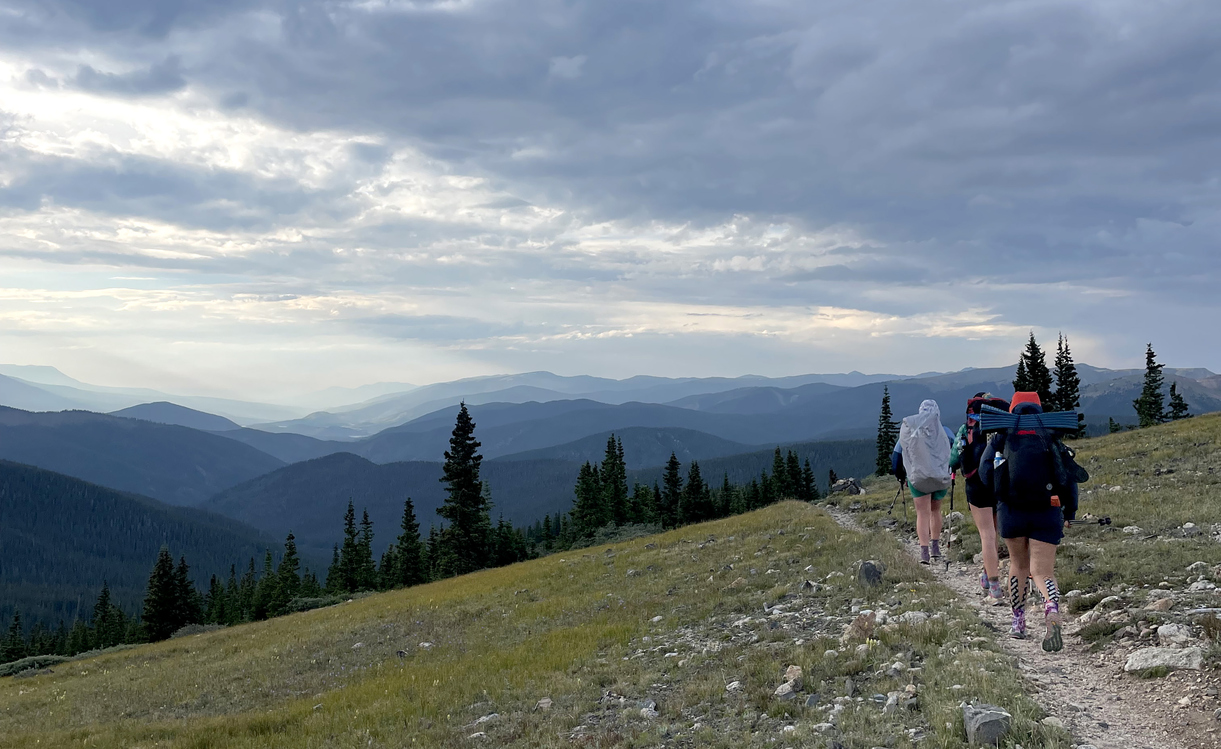 Hilde Ringger, Bella Kolander and Ariella Nardizzi hike just past Georgia Pass on the Colorado Trail on Aug. 8. (Kyla Pearce, the gazette)