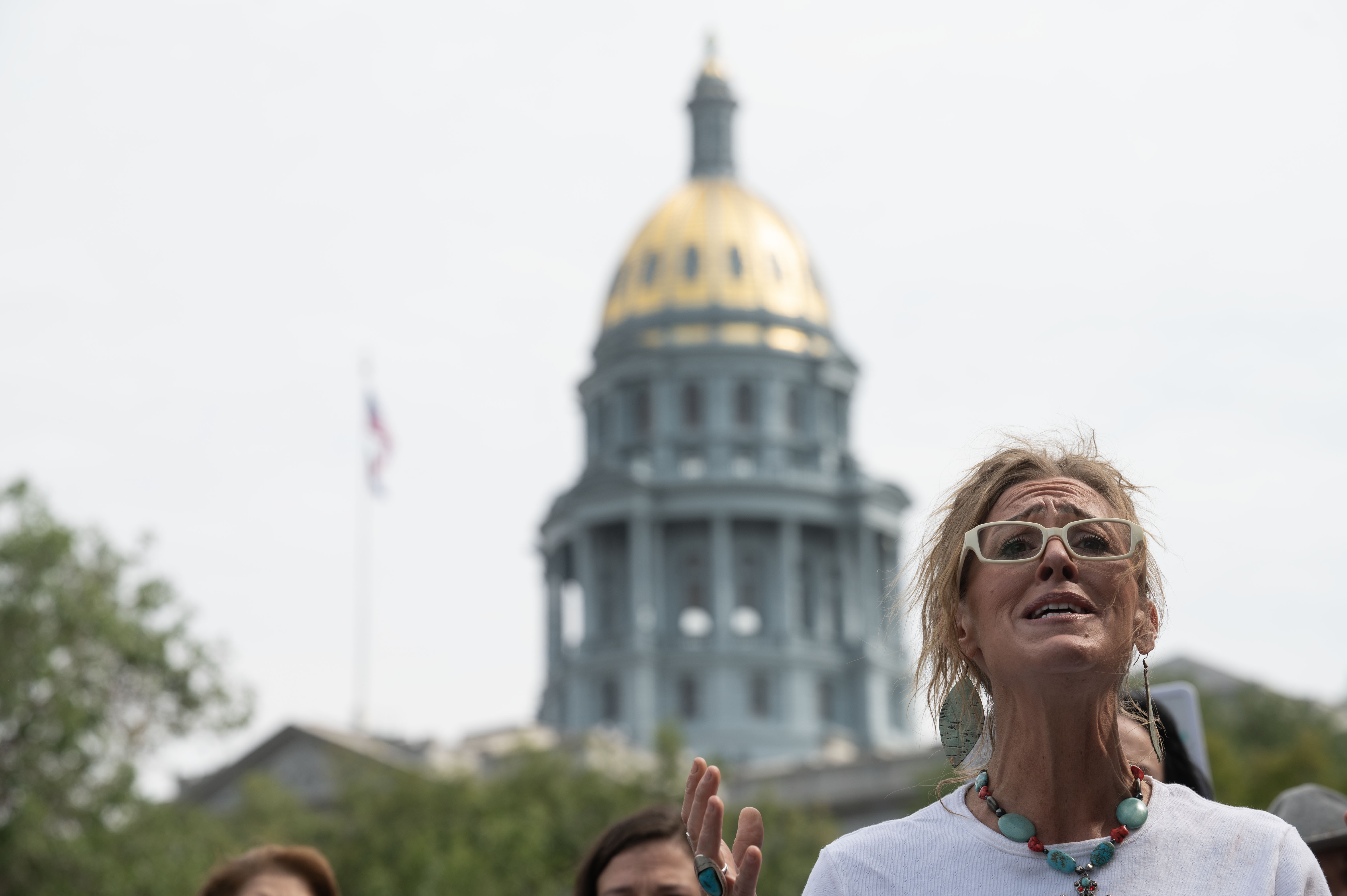 Rachel Pickrel-Hawkins addresses the media during a rally calling for family court reforms outside the Ralph L. Carr Colorado Justice Center in Denver on Thursday, Sept. 5, 2024. Pickrel-Hawkins was jailed for opposing reunification therapy between her two youngest sons and her ex-husband, who is facing multiple criminal charges of sexually and physically abusing their children, according to a press release. (Stephen Swofford, Denver Gazette) (Stephen Swofford Denver Gazette)