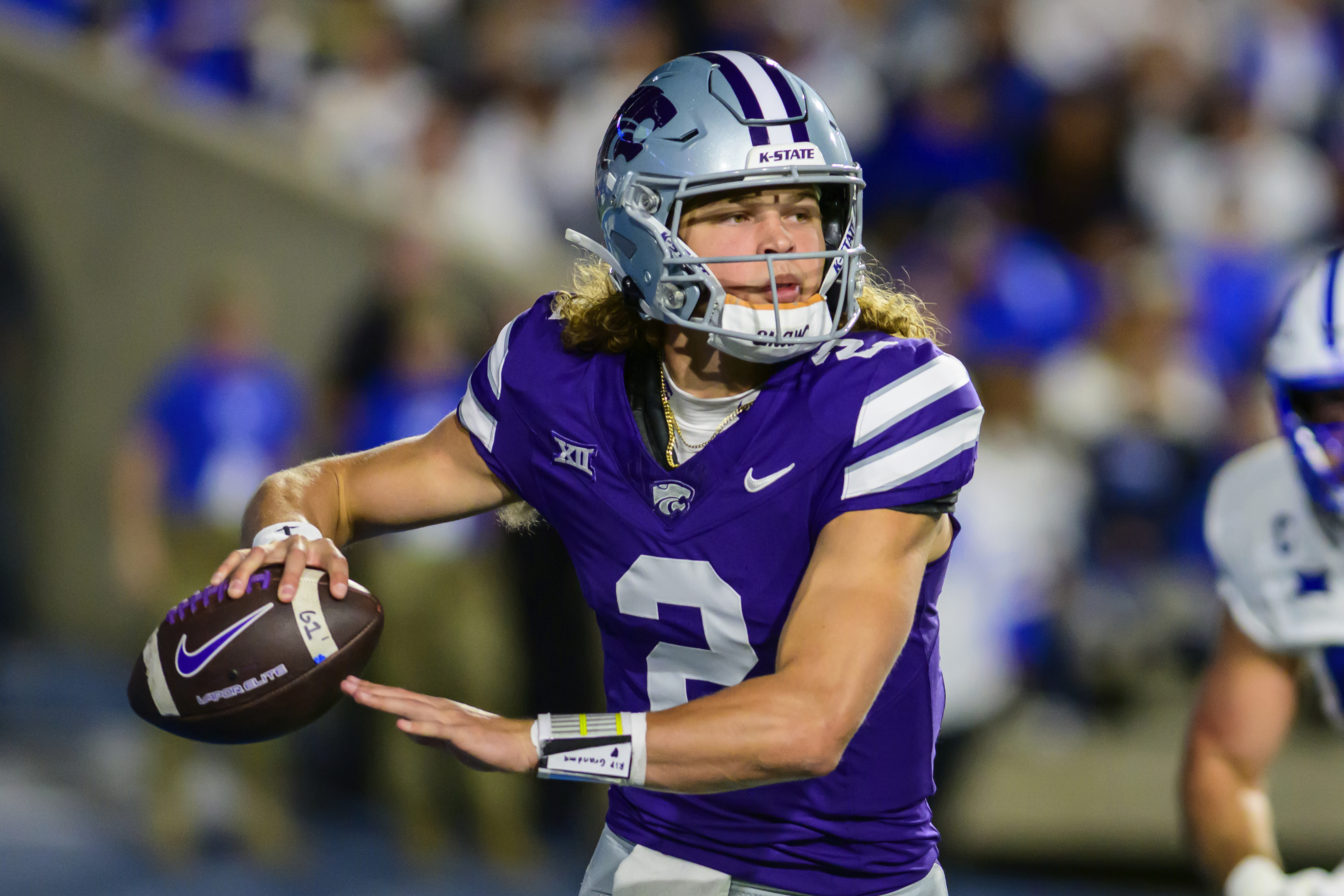Kansas State quarterback Avery Johnson (2) runs out of the pocket and looks to pass during the first half of an NCAA college football game against BYU, Saturday, Sept. 21, 2024, in Provo, Utah. (AP Photo/Tyler Tate) (Tyler Tate)