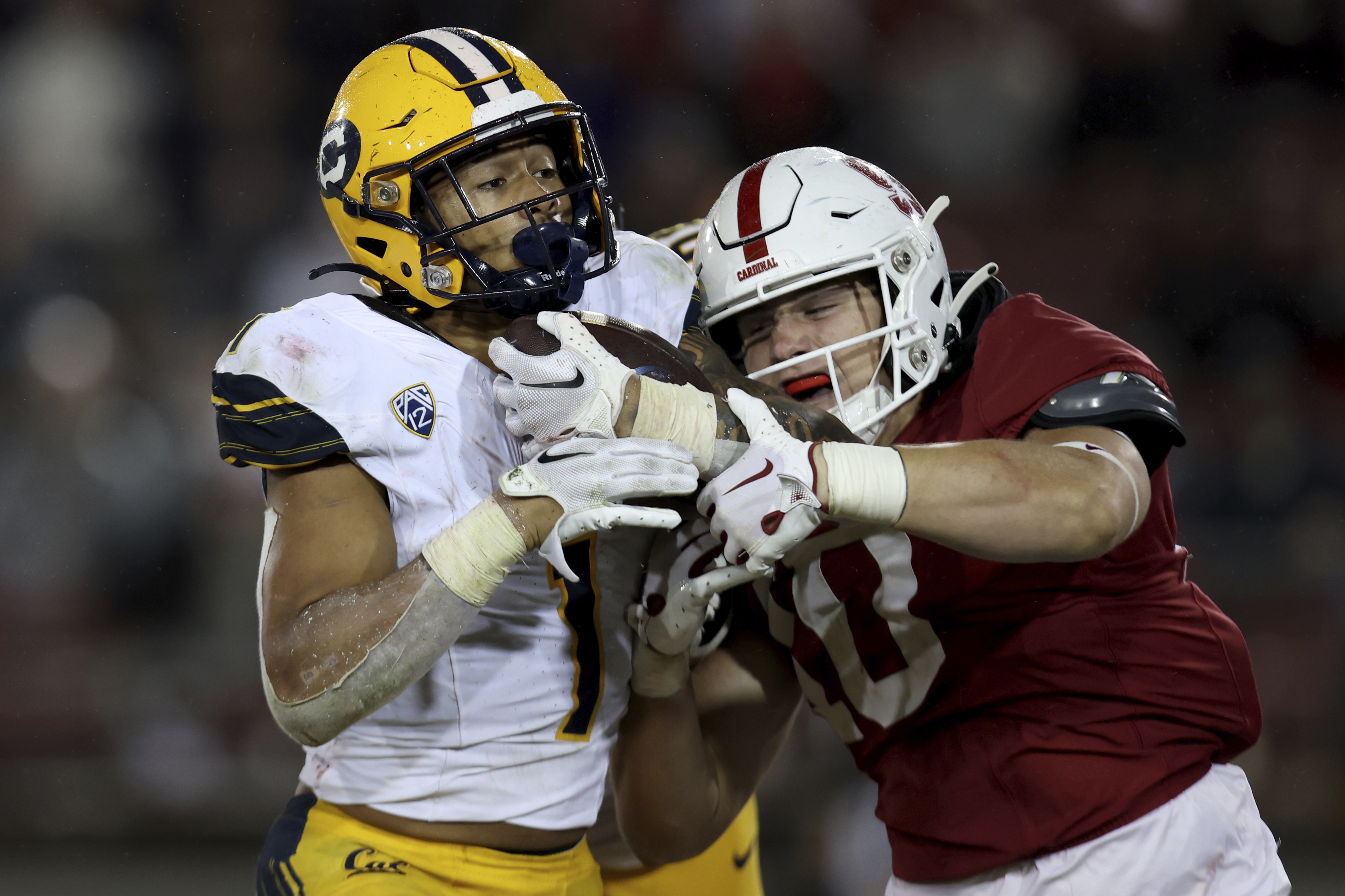 California running back Jaydn Ott, left, runs for a touchdown against Stanford linebacker Spencer Jorgensen, right, during the second half of an NCAA college football game in Stanford, Calif., Saturday, Nov. 18, 2023. (AP Photo/Jed Jacobsohn) (Jed Jacobsohn)