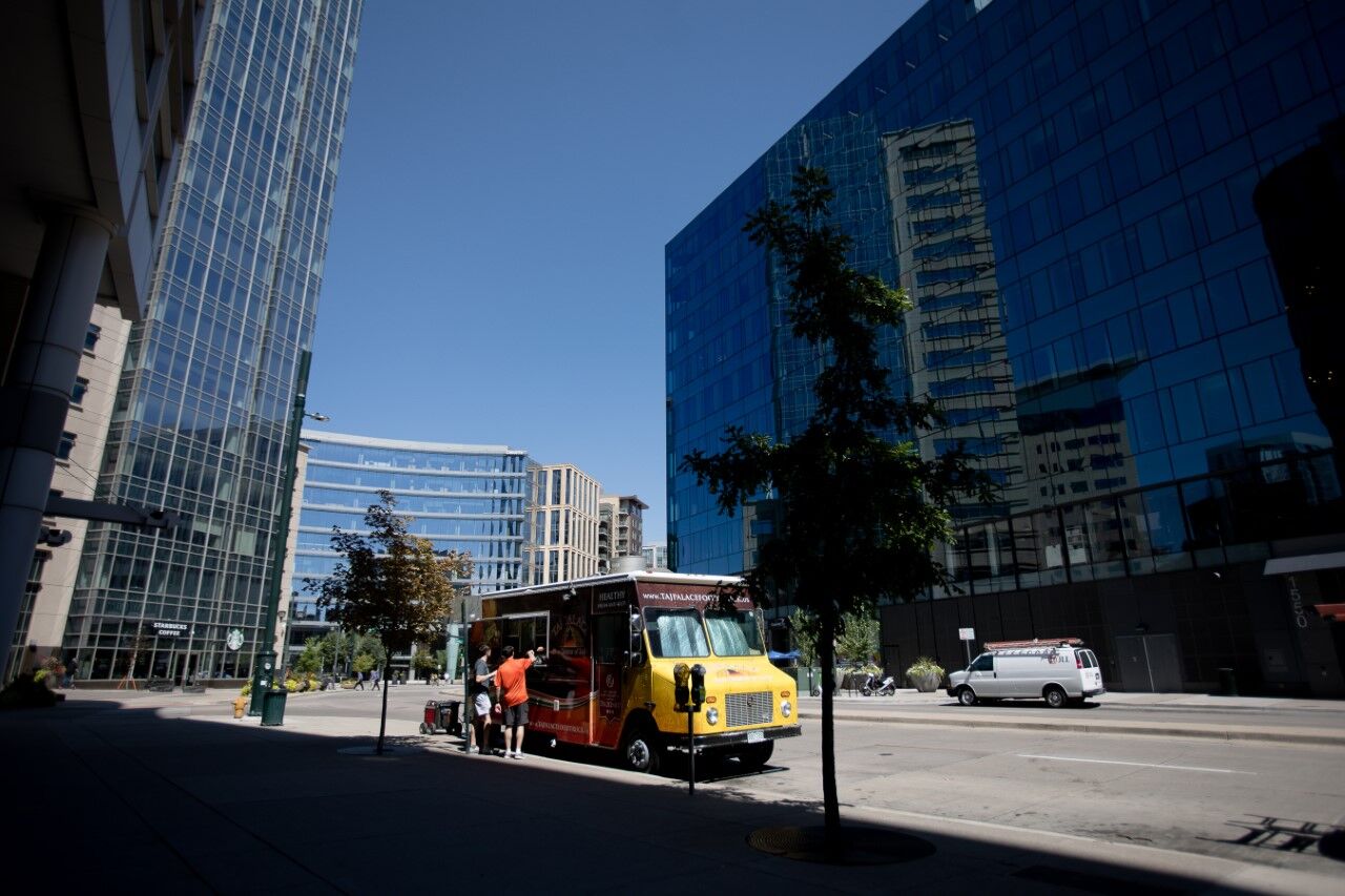 FILE PHOTO: Customers buy food from a food truck in downtown Denver on Friday, Sept. 2, 2022. (Sara Hertwig/Special to The Denver Gazette)