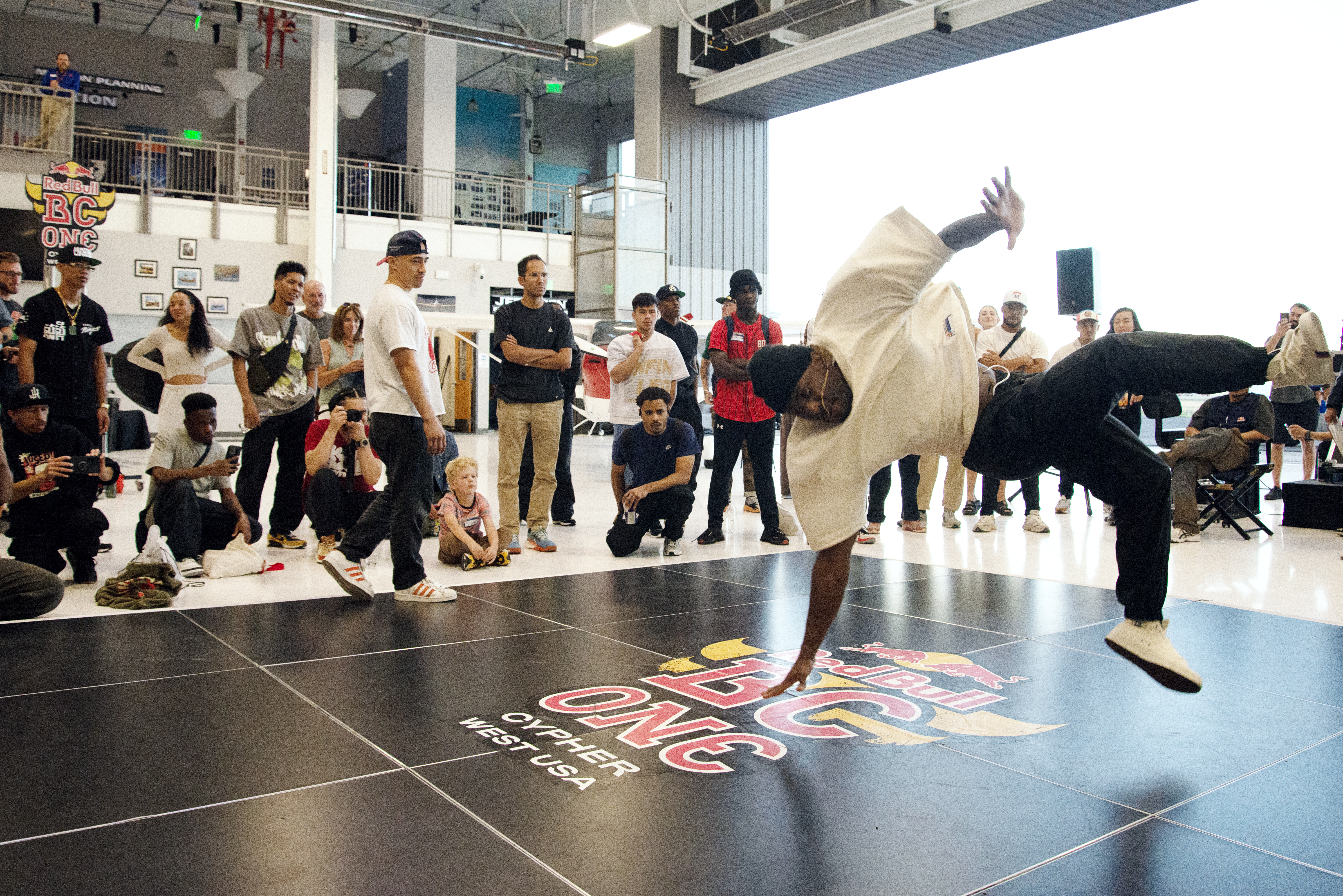 Camron Branch leaves the ground while performing in the Red Bull BC One West Cypher preliminary event Friday, Sept. 20, 2024 at the Wings Over the Rockies Exploration of Flight museum Centennial, Colo. (TomHellauerMultimedia Producertom.hellauer@denvergazette.comhttps://denvergazette.com/content/tncms/avatars/f/9e/622/f9e6228a-3b6b-11ed-bf10-fbb71fa8e421.f54b911252c540f1d61709edc4727a39.png)
