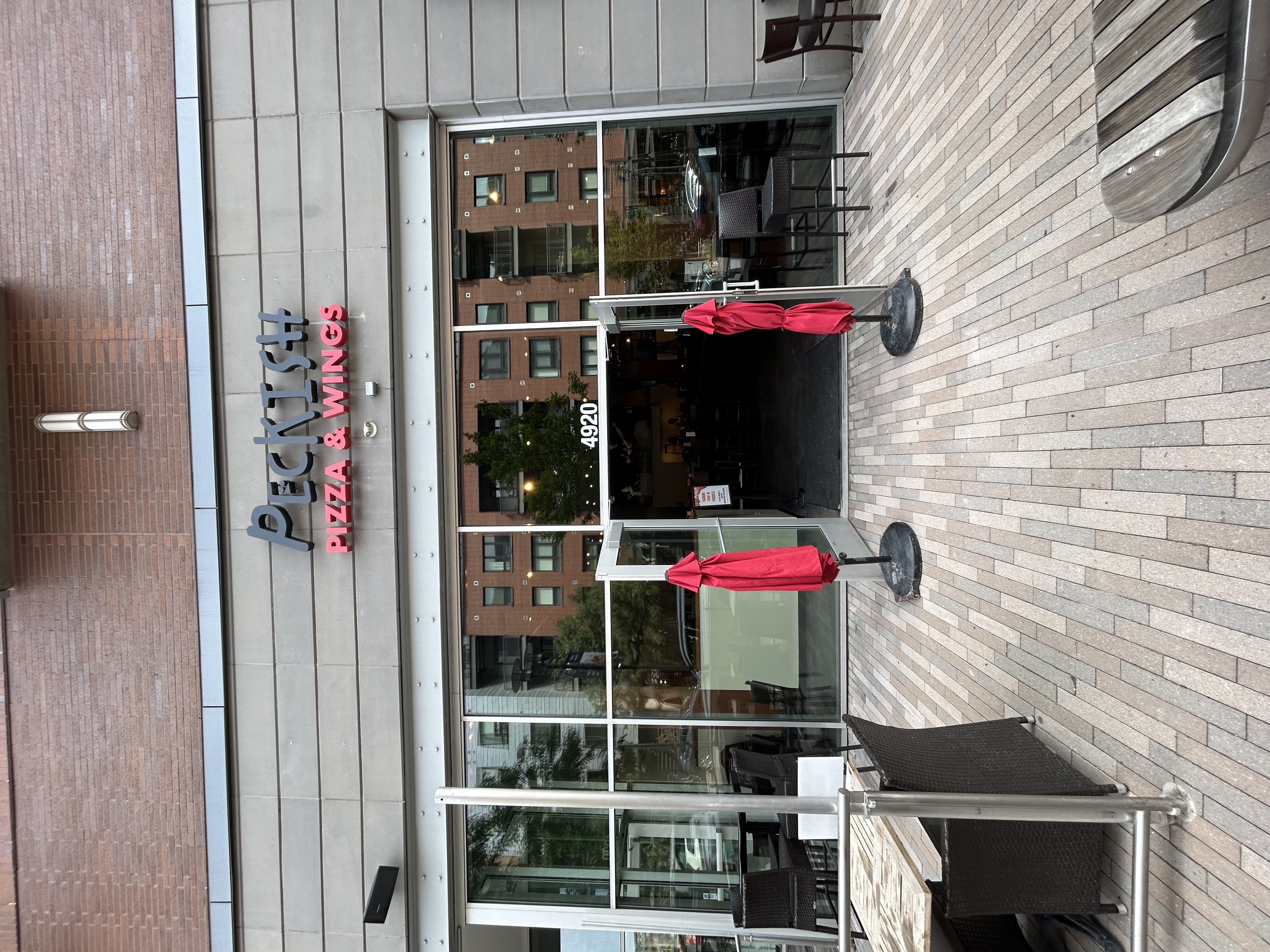 Boulder's Peckish Pizza opened its second location this month at Belleview Station, 4920 S. Newport Street, Denver. The restaurant also serves wings and chicken sandwiches. (Courtesy photo, Peckish Pizza)