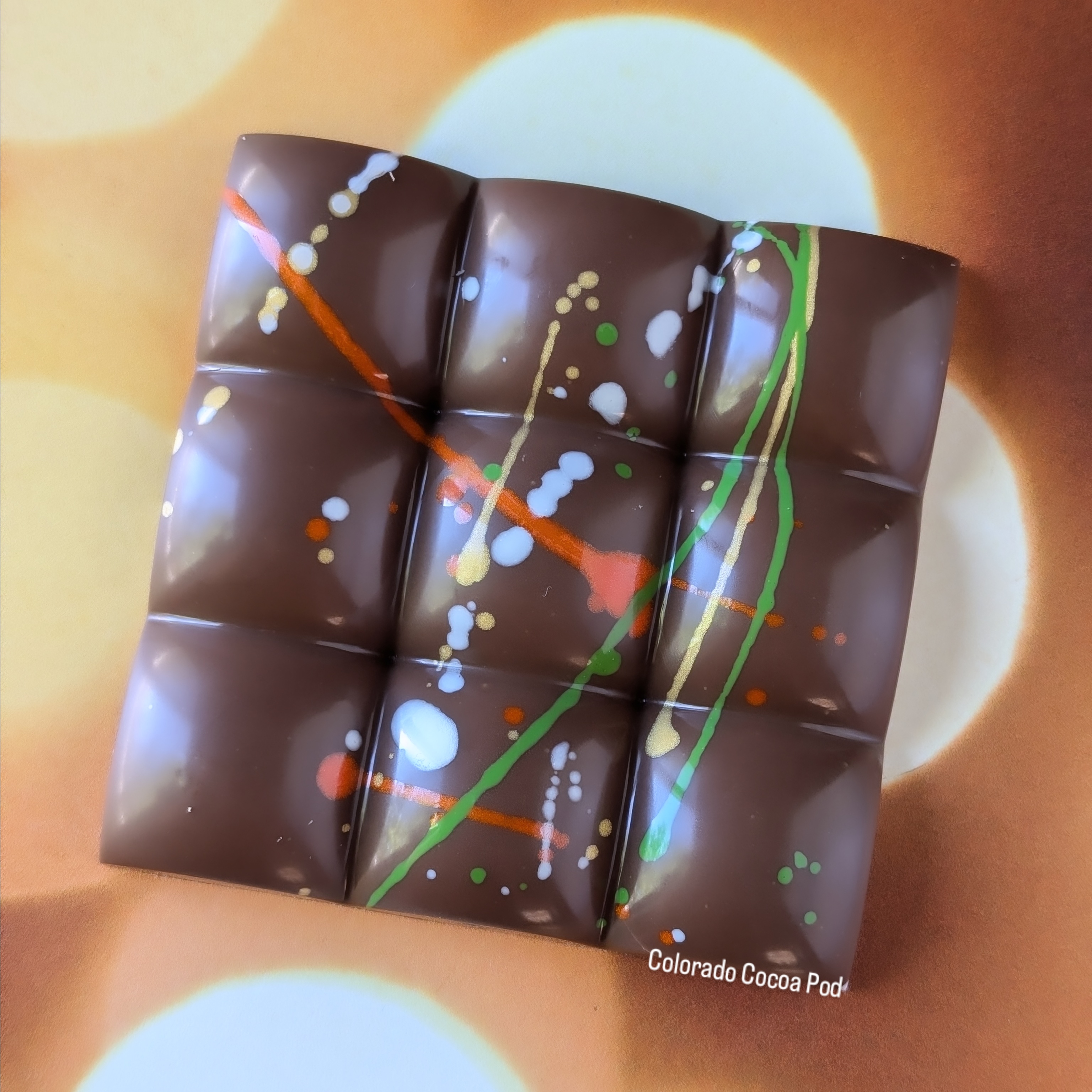 Colorado Cocoa Pod’s hand-painted Dubai Pistachio Bar, inspired by a viral TikTok trend. Crafted with premium ingredients like pistachio praline and kataifi, this artisanal treat offers a luxurious take on the Middle Eastern-inspired dessert. (Courtesy: Colorado Cocoa Pod)