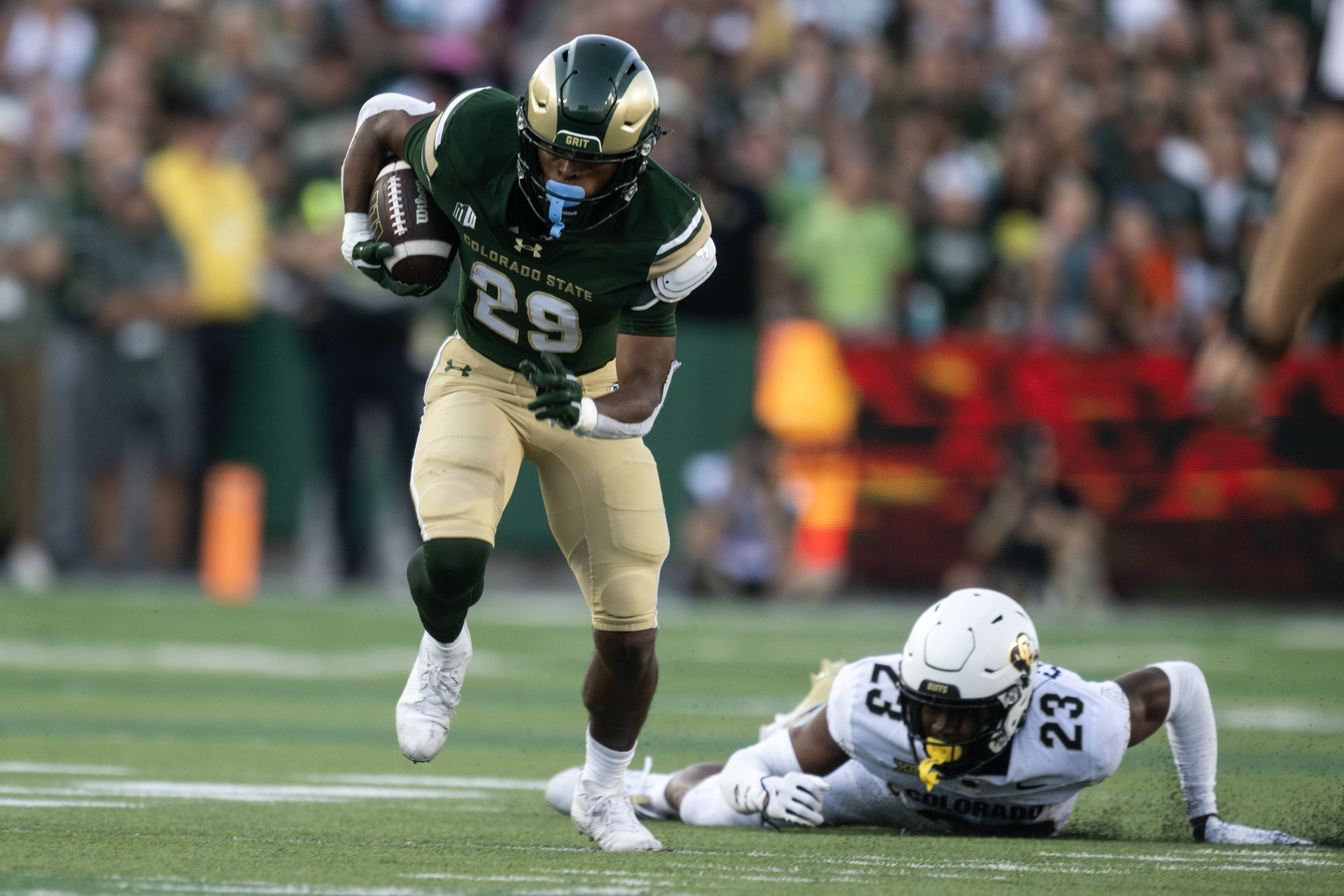 Colorado State freshman running back Justin Marshall (24) dodges a tackle by Colorado sophomore safety Carter Stoutmire (23) during the first half of the Rocky Mountain Showdown on Saturday, Sept. 14, 2024 at Canvas Stadium in Fort Collins. (Stephen Swofford, Denver Gazette) (Stephen Swofford Denver Gazette)