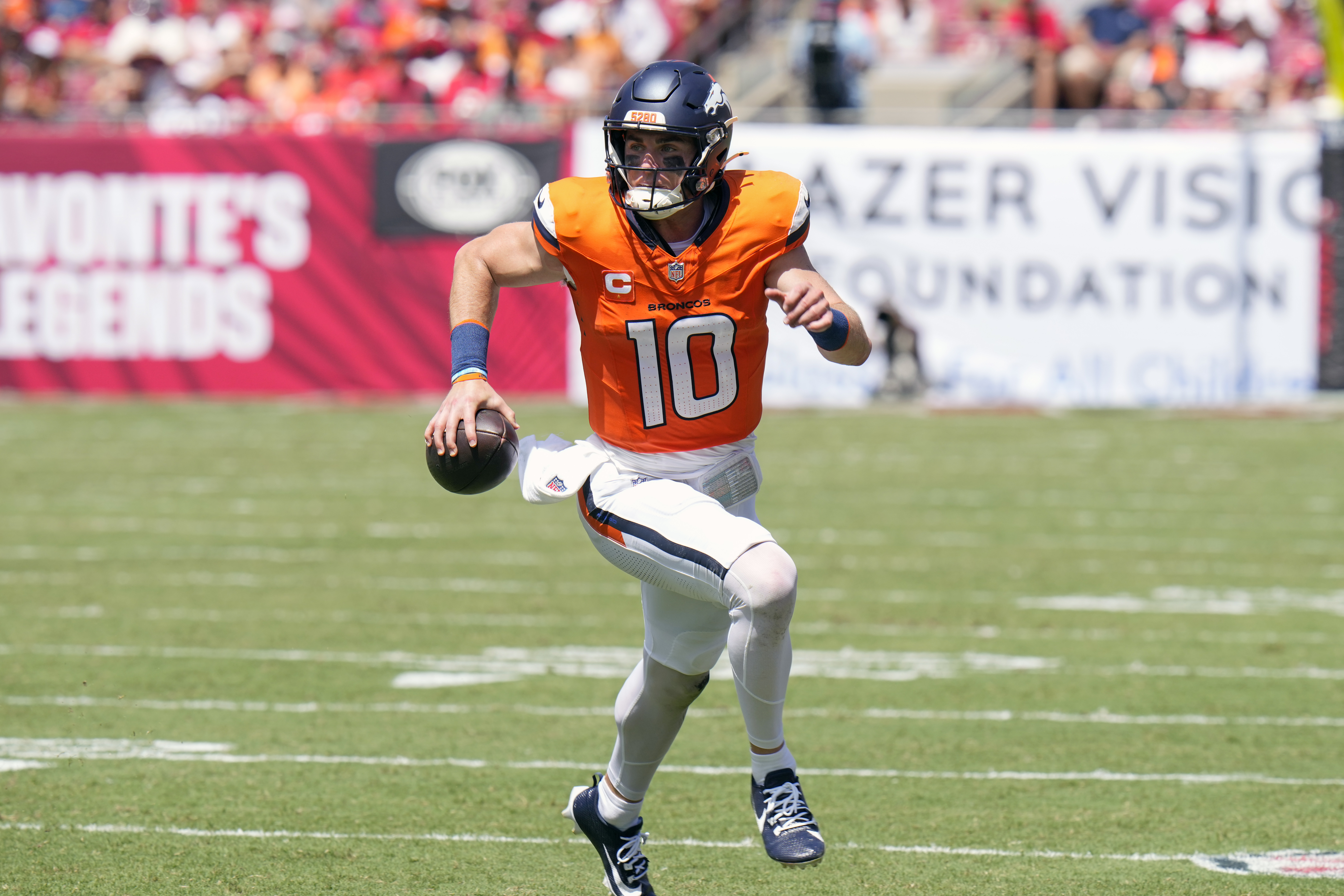 Denver Broncos quarterback Bo Nix (10) scrambles against the Tampa Bay Buccaneers during the first half of an NFL football game, in Tampa, Fla. on Sunday, Sept. 22, 2024. (AP Photo/Chris O'Meara) (Chris O'Meara)