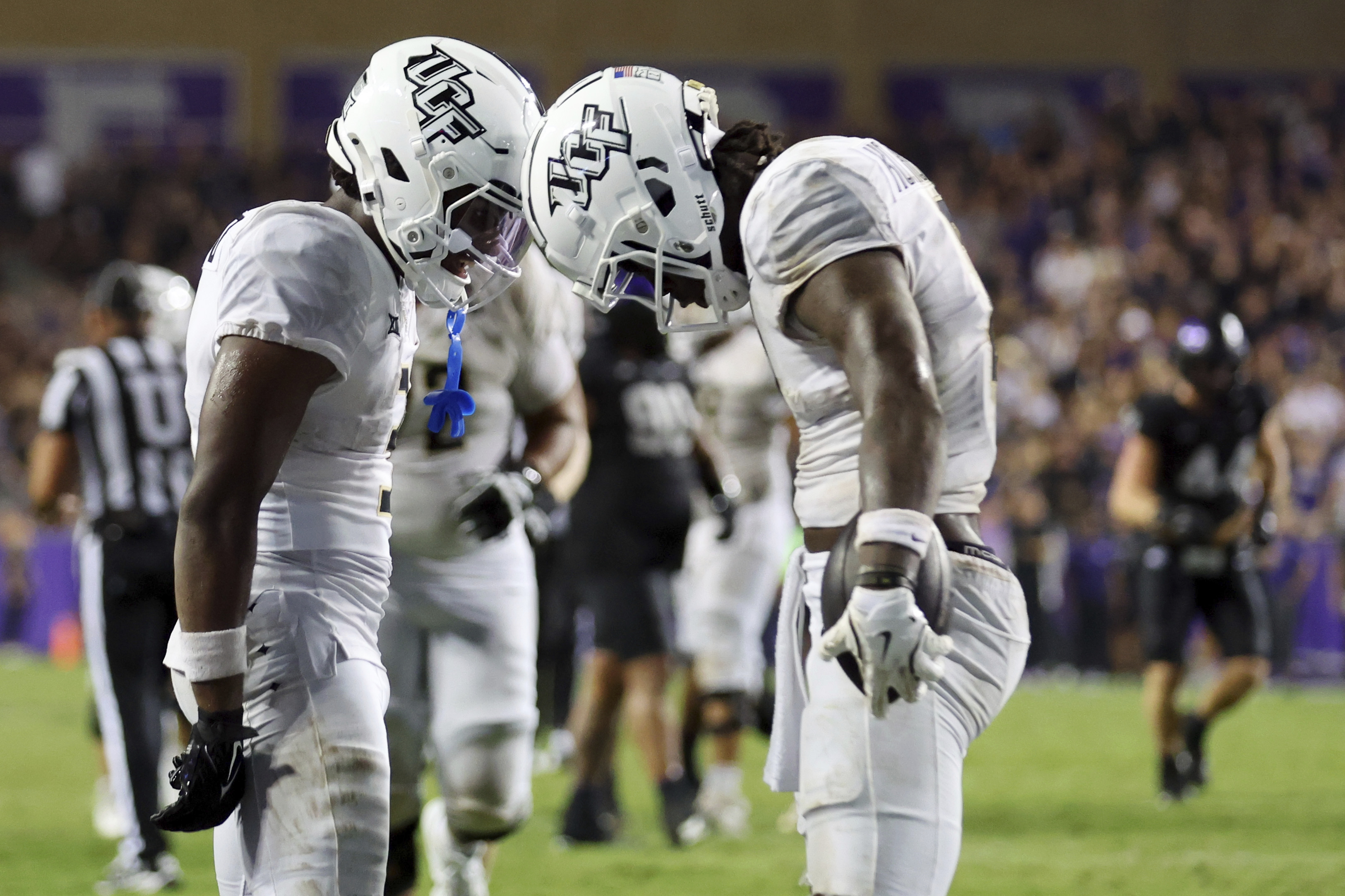 Central Florida wide receiver Xavier Townsend (3), left, celebrates the game tying touchdown by wide receiver Kobe Hudson (2), right, in the fourth quarter against TCU during an NCAA college football game Saturday, Sept. 14, 2024, in Fort Worth, Texas. (AP Photo/Richard W. Rodriguez) (Richard W. Rodriguez)
