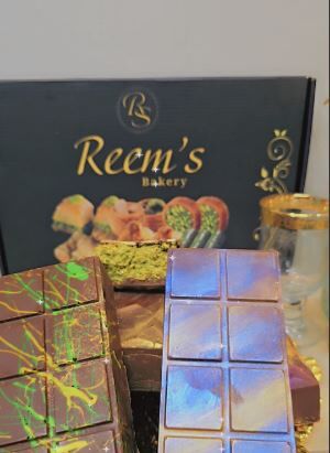 Reem’s Bakery offers a variety of hand-crafted Dubai Pistachio Bars, made with premium ingredients and vibrant designs that showcase their artisanal approach to chocolate-making. (Courtesy: Reem's Bakery)