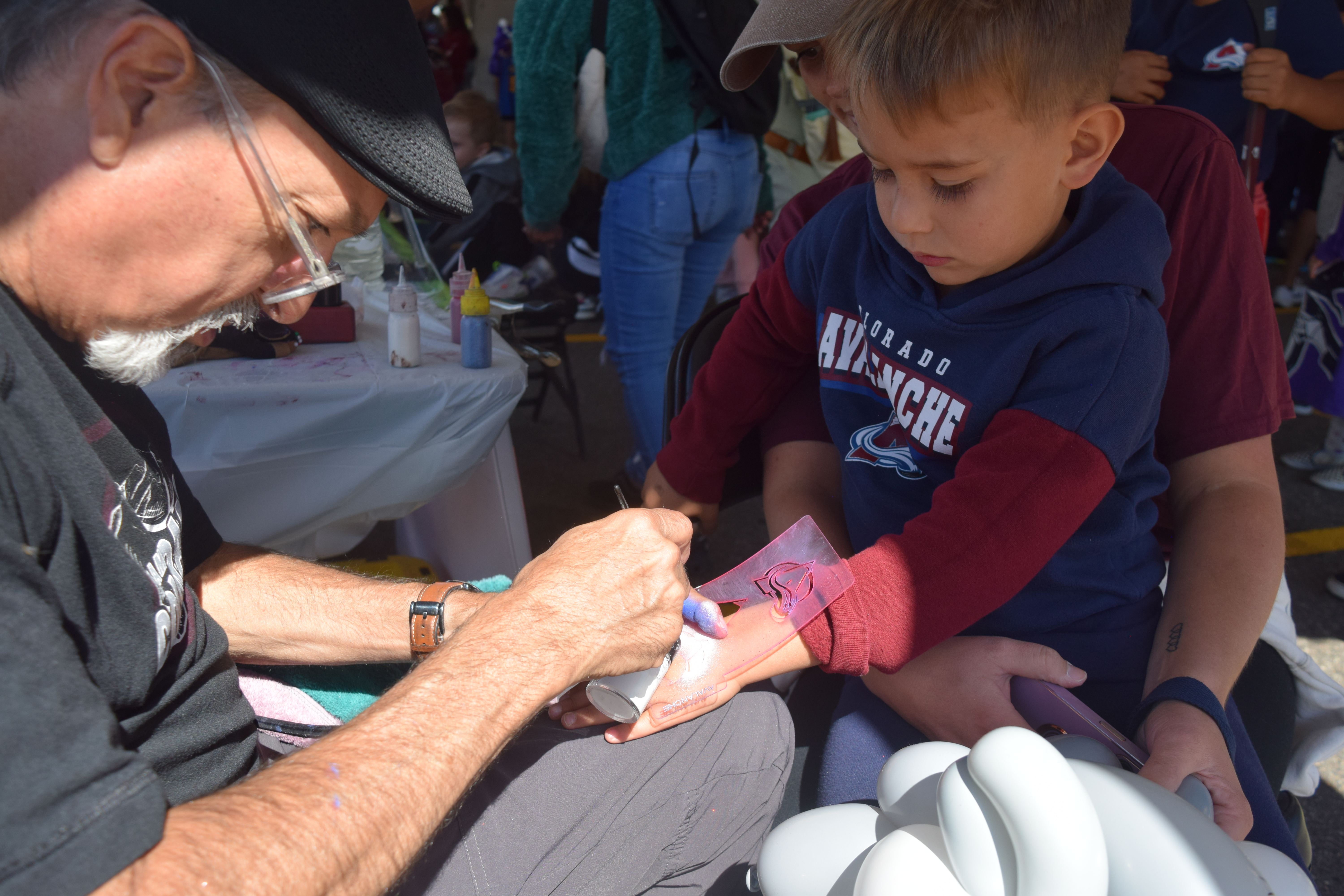Gary Maes stencils a Colorado Avalanche logo on five-year-old Santino Pane at the Ball Fall Fest on Saturday. The event had various activities for all members of the family. (SageKelleyJefferson County Reportersage.kelley@denvergazette.comhttps://denvergazette.com/content/tncms/avatars/e/5f/457/e5f45740-2717-11ee-85b2-ab80f2d36252.5b966c1d2ce4987987665d57c237eda4.png)