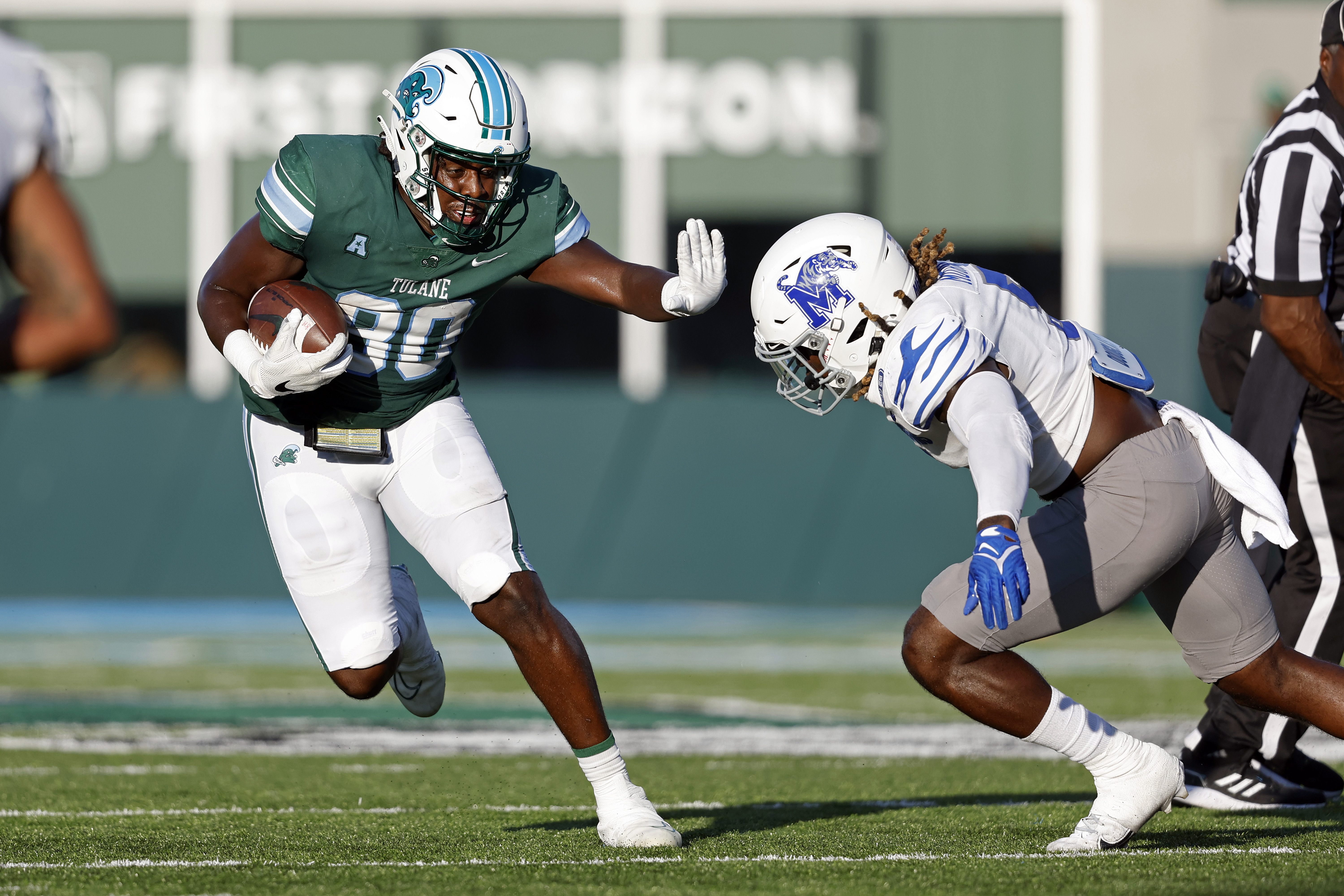 Tulane tight end Tyrick James (80) is tackled by Memphis linebacker Tyler Murray (5) during the second half of an NCAA college football game in New Orleans, Saturday, Oct. 22, 2022. Tulane won 38-28. (AP Photo/Tyler Kaufman) (Tyler Kaufman)