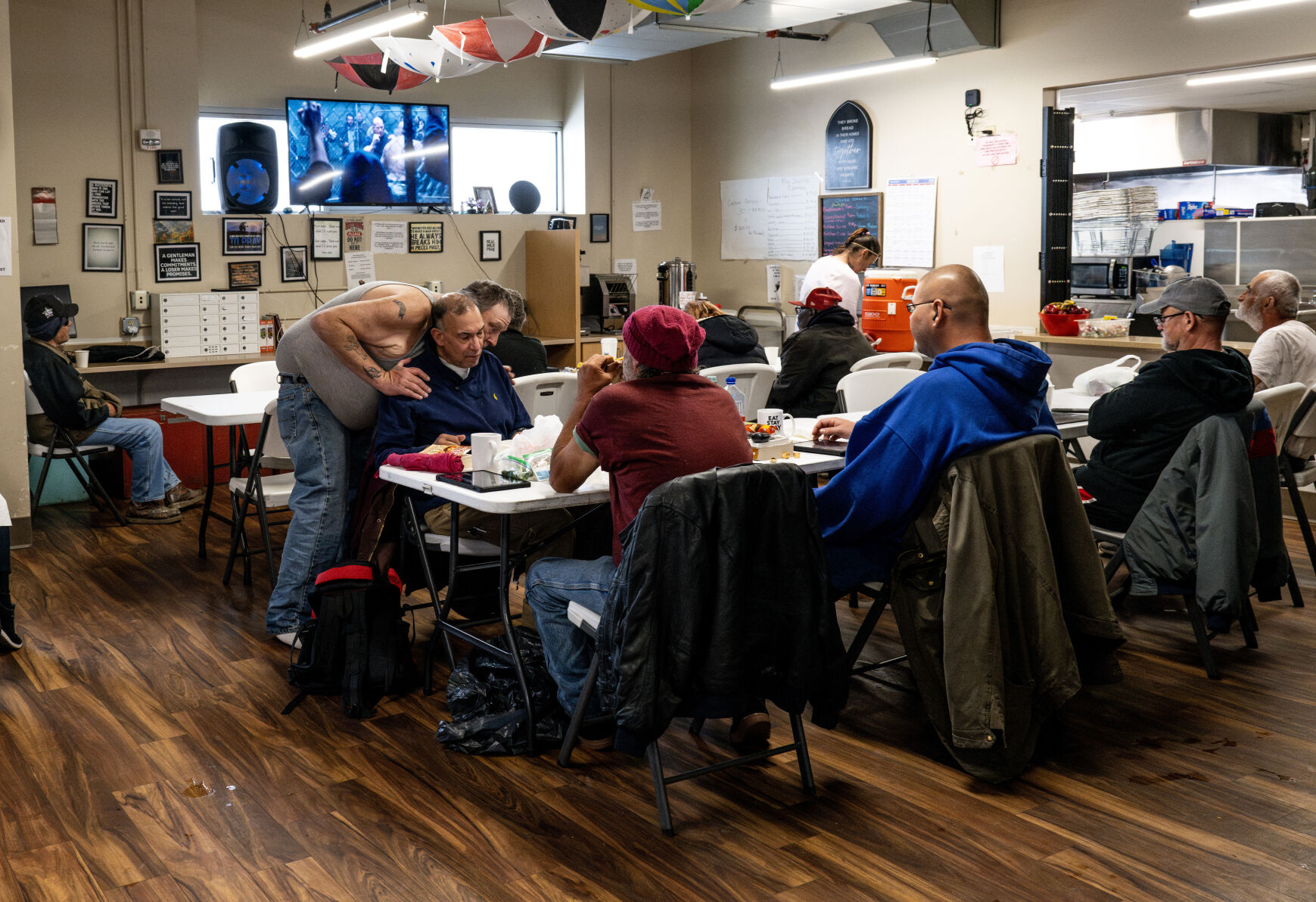 Residents of the Pueblo Rescue Mission sit in a community room Thursday, March 14, 2024, in Pueblo, Colo. The revived Pueblo Rescue Mission is using the Colorado Springs Rescue Mission as a model for their plan to build a mega campus for homeless services near downtown. (Parker Seibold, The Gazette) (Parker Seibold)