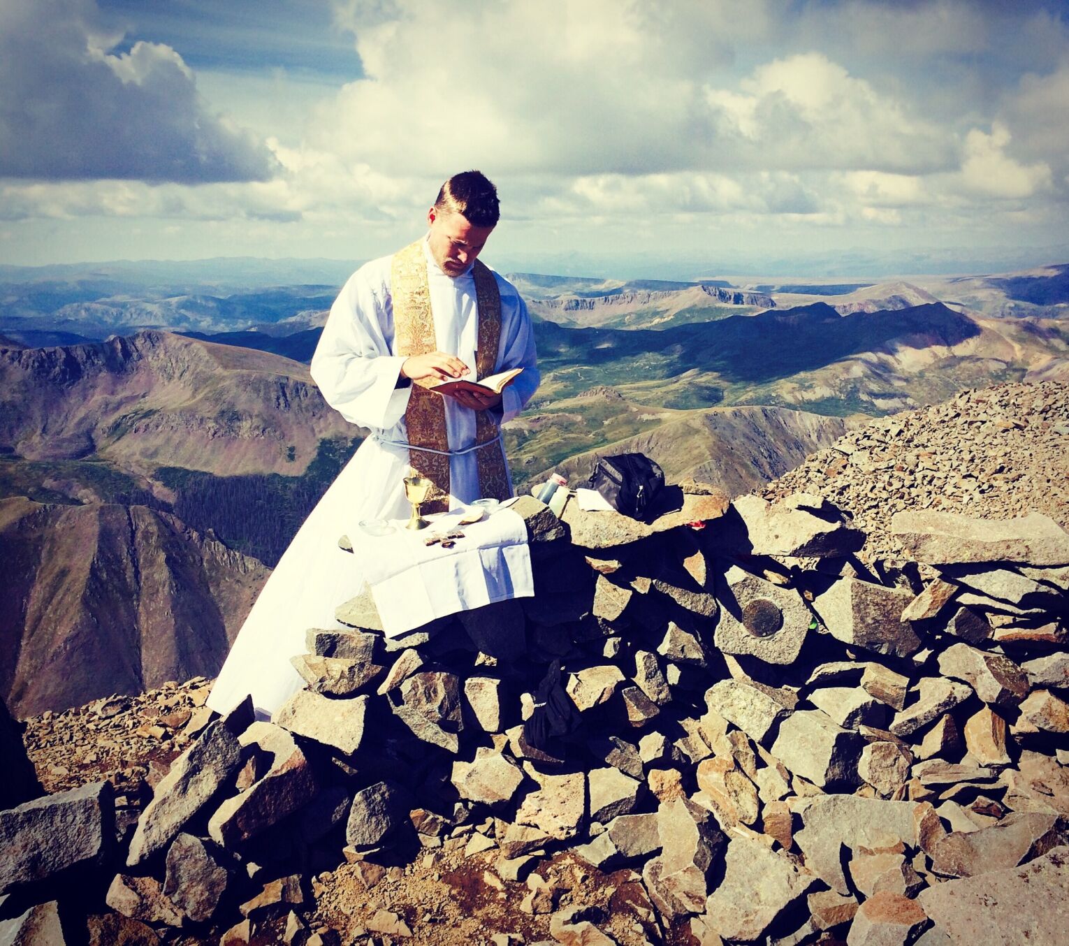 {span}Father John Nepil saying mass on Wetterhorn Peak. Courtesy photo{/span}