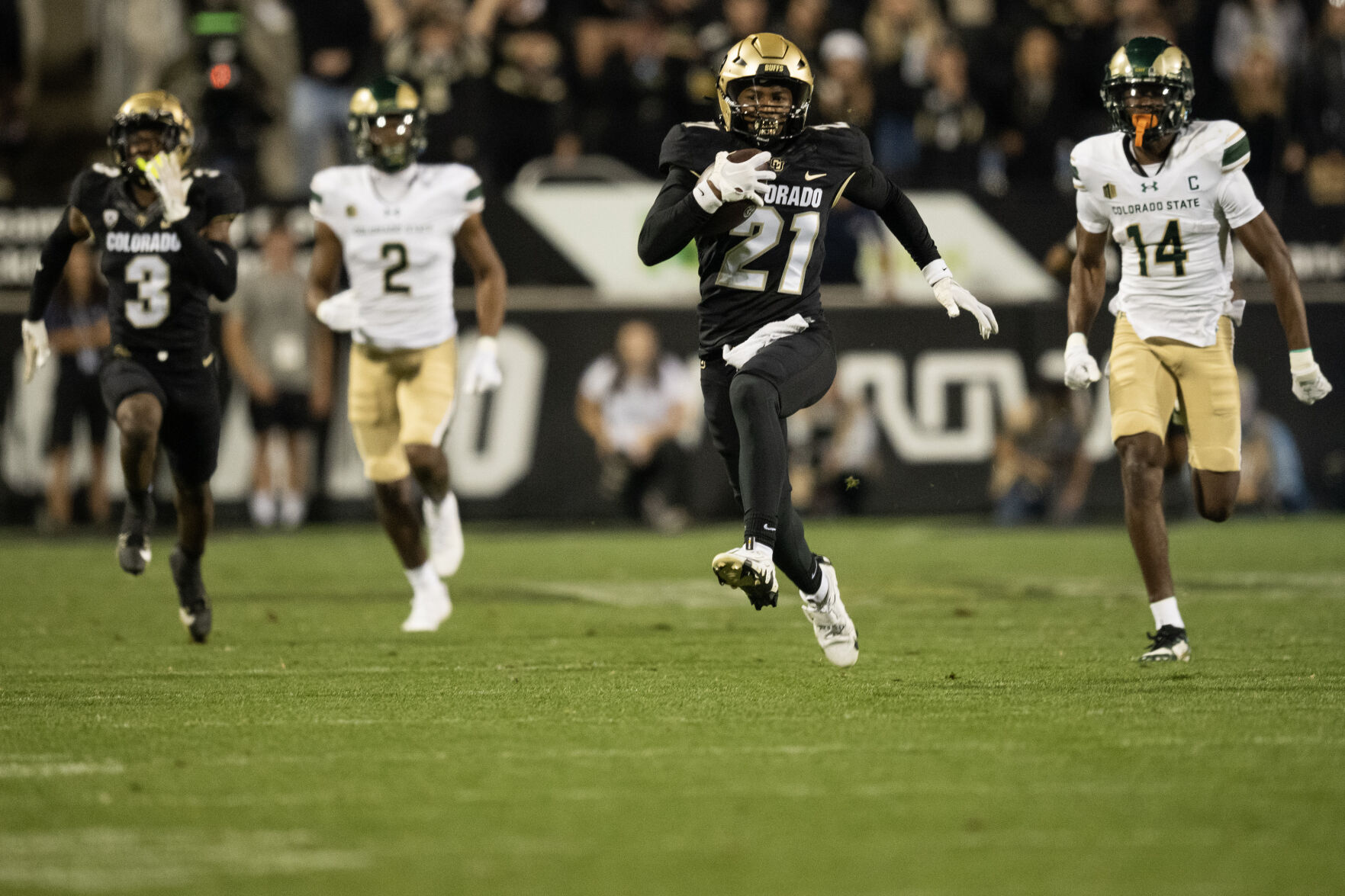 Colorado Buffaloes safety Shilo Sanders (21) runs back an interception on Colorado State Rams quarterback Brayden Fowler-Nicolosi (16) during the first quarter of the Rocky Mountain Showdown at Folsom Field on Saturday, Sept. 16, 2023, in Boulder, Colo. (Timothy Hurst/Denver Gazette) (TimHursttim.hurst@gazette.comhttps://secure.gravatar.com/avatar/aca82bd62b4ee425c598527cd6faa1b1?d=mm&r=g)