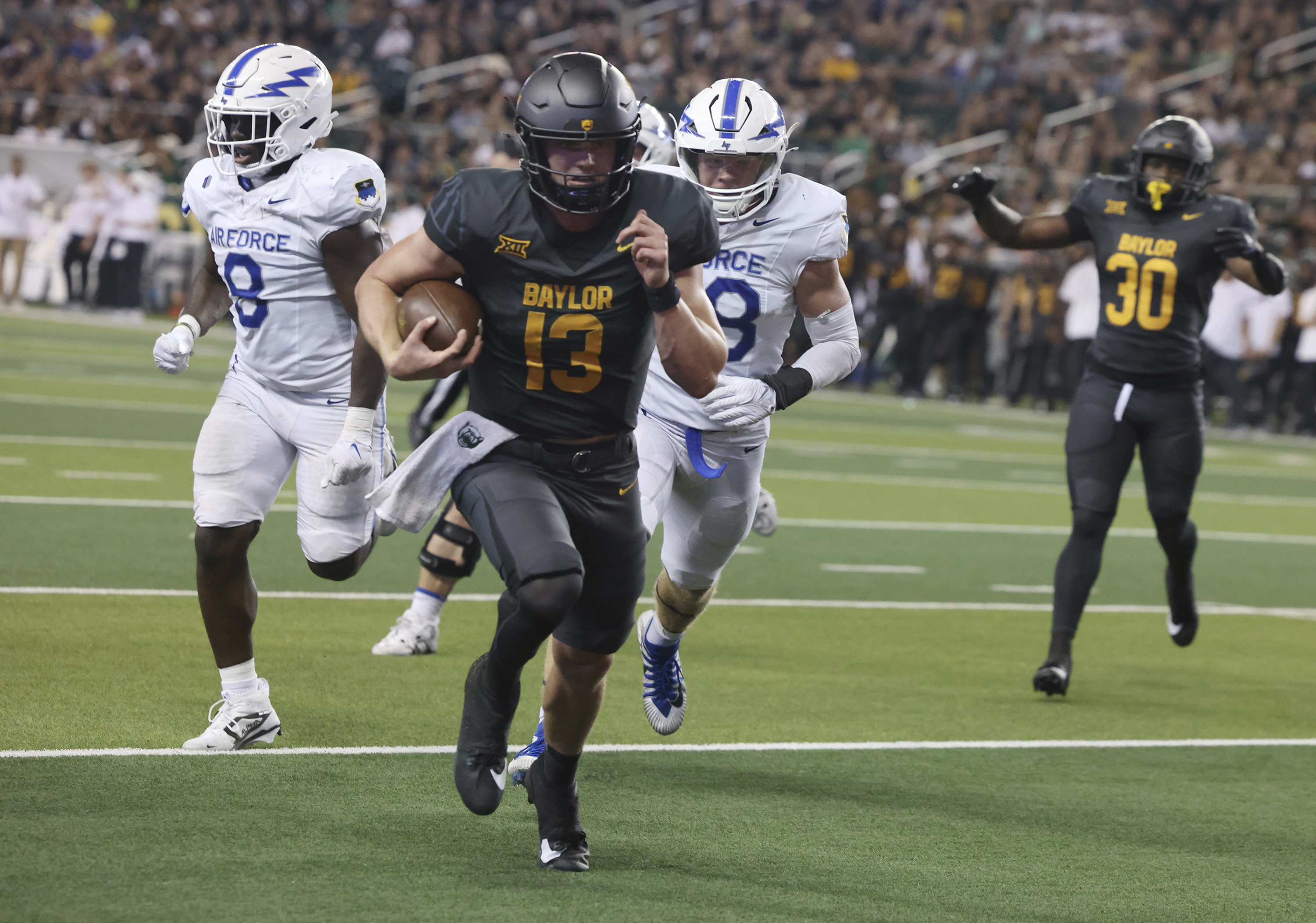 Baylor quarterback Sawyer Robertson (13) runs untouched into the end zone for a touchdown in the second half of an NCAA college football game against Air Force, Saturday, Sept. 14, 2024, in Waco, Texas. (Rod Aydelotte/Waco Tribune-Herald, via AP) (Rod Aydelotte)