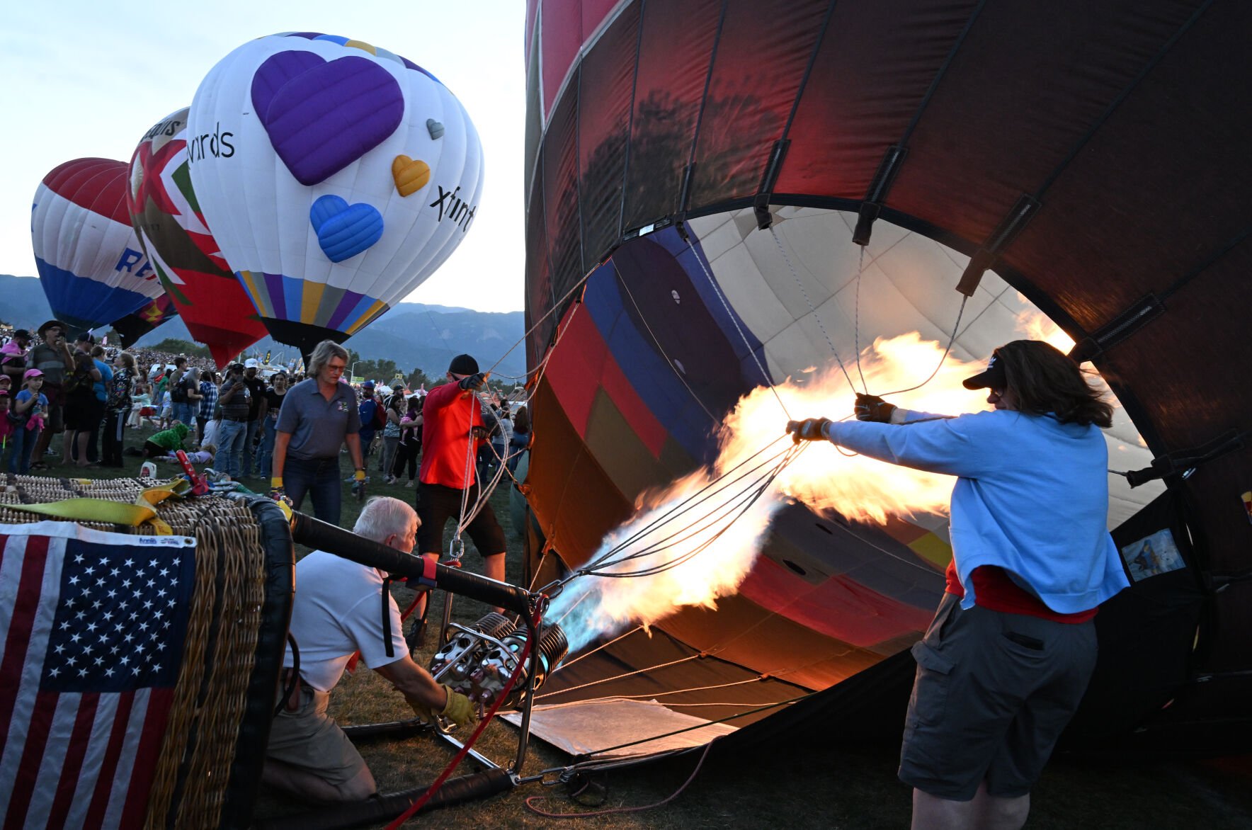 Balloons start to inflate during the balloon glow of the Colorado Springs Labor Day Lift Off on Sunday, Sept. 1, 2024.