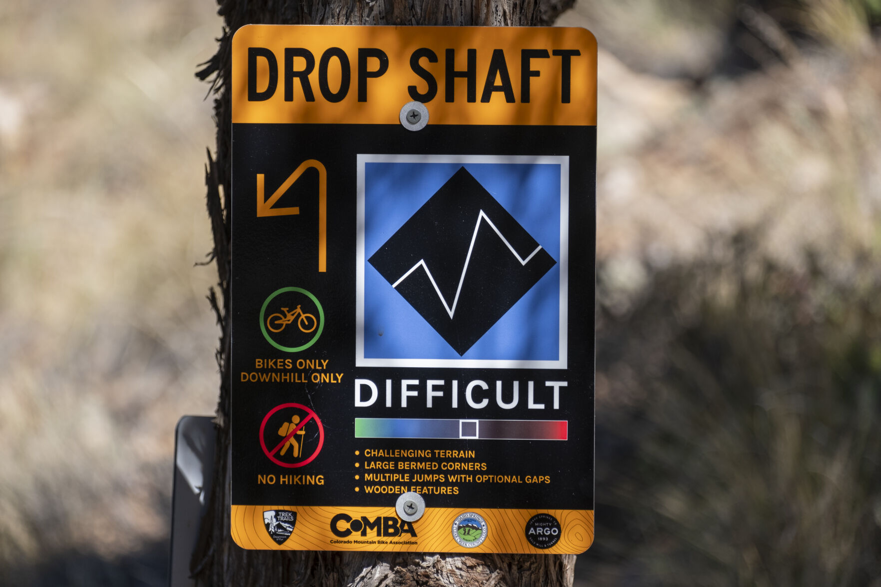 A sign hangs from a tree showing mountain bike riders the way to Drop Shaft trail Thursday, Sept. 26, 2024 at Virginia Canyon Mountain Park in Idaho Springs, Colorado. (JonathanIngrahamDigital Strategistjonathan.ingraham@denvergazette.comhttps://denvergazette.com/content/tncms/avatars/c/dd/7f0/cdd7f086-b693-11ec-b373-bba598953eb6.fc0f5608a6f1144f64f080f771bd904d.png)