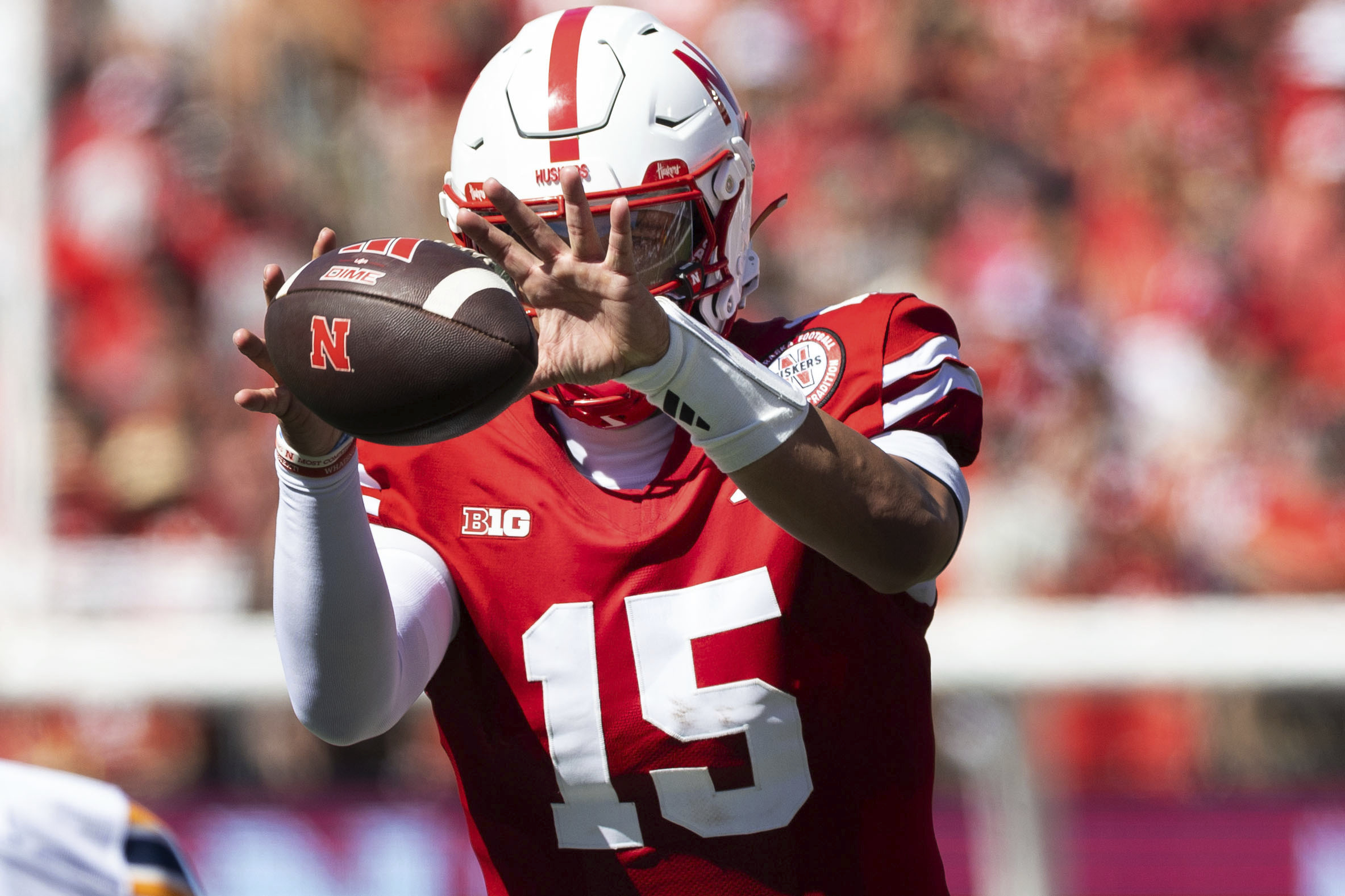 Nebraska's Dylan Raiola (15) takes a snap during the first half of an NCAA college football game against UTEP in Lincoln, Neb., Saturday, Aug. 31, 2024. (Chris Machian/Omaha World-Herald via AP) (Chris Machian)