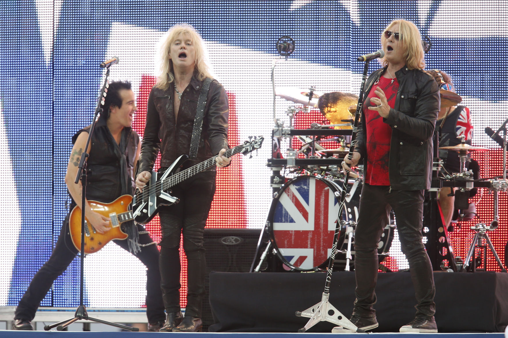 FILE PHOTO: Def Leppard performs before an NFL football game between the Miami Dolphins and the Oakland Raiders, Sunday, Sept. 28, 2014, at Wembley Stadium in London. The band performs with Journey and Cheap Trick at Coors Field Sunday. (AP Photo/Lefteris Pitarakis) (Lefteris Pitarakis/Associated Press)