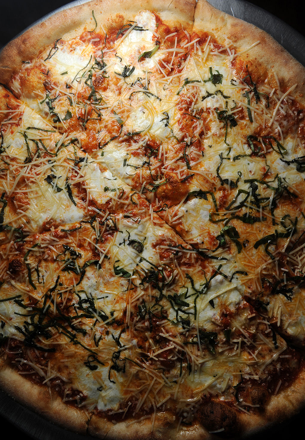 Slice 420 Pizza and Crepes Restaurant :New Yorks Margarita” — Crushed San Marzono tomatoes, house made mozzarella, cold pressed olive oil, Pecerino Ramono topped fresh basil Wednesday January 24, 2018. Photo by Jeff Kearney. . (Jeff Kearney)