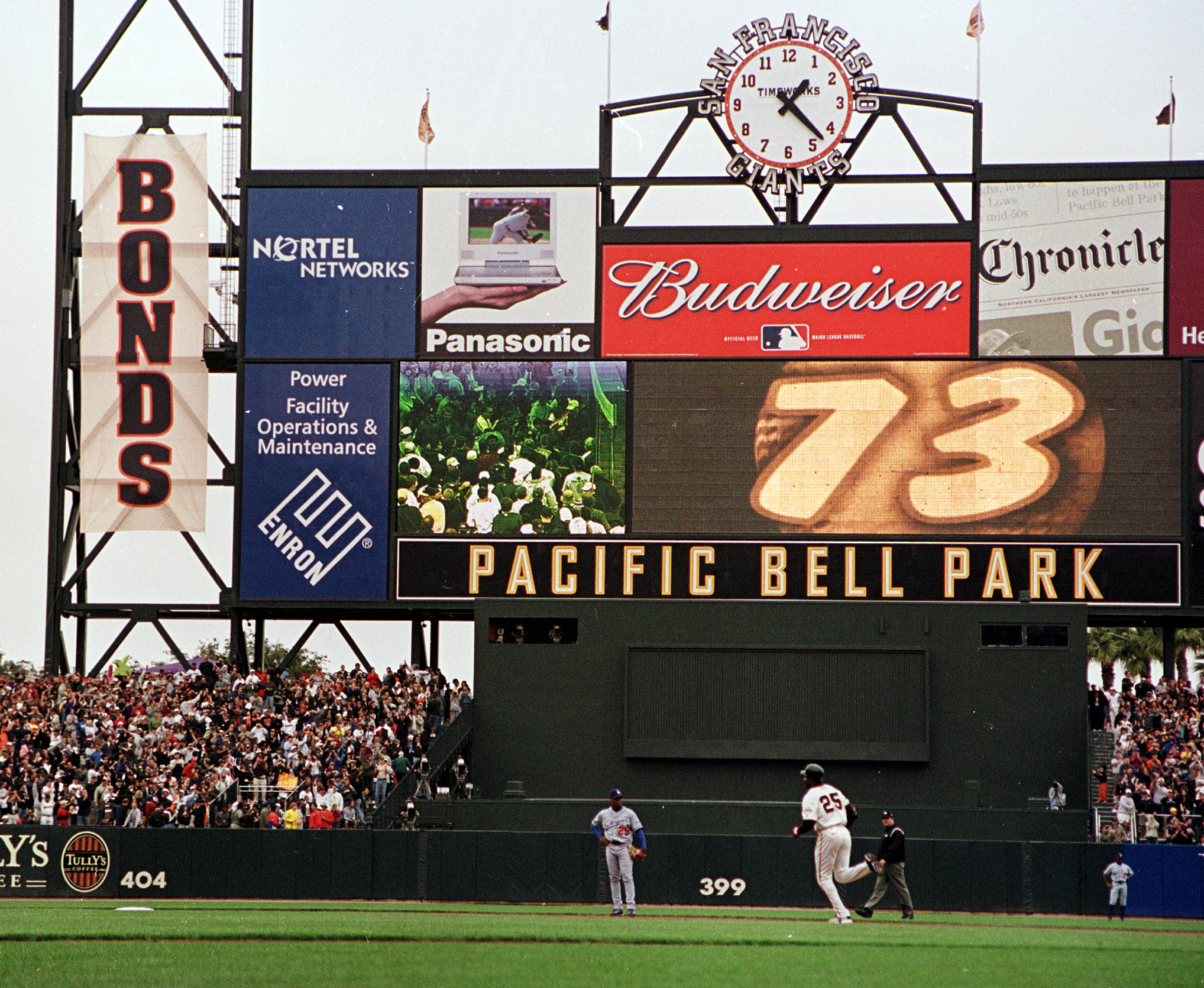 San Francisco Giants' Barry Bonds (25) circles the bases after he hit his 73rd home run of the season against the Los Angeles Dodgers, Sunday, Oct. 7, 2001, at Pacific Bell Park in San Francisco. Bonds has the record for most home runs in a season beating Mark McGwire's home run record of 70 set in 1998. Looking on is Dodgers' shortstop Adrian Beltre and second base umpire Jerry Layne. (AP Photo/Eric Risberg) (ERIC RISBERG)