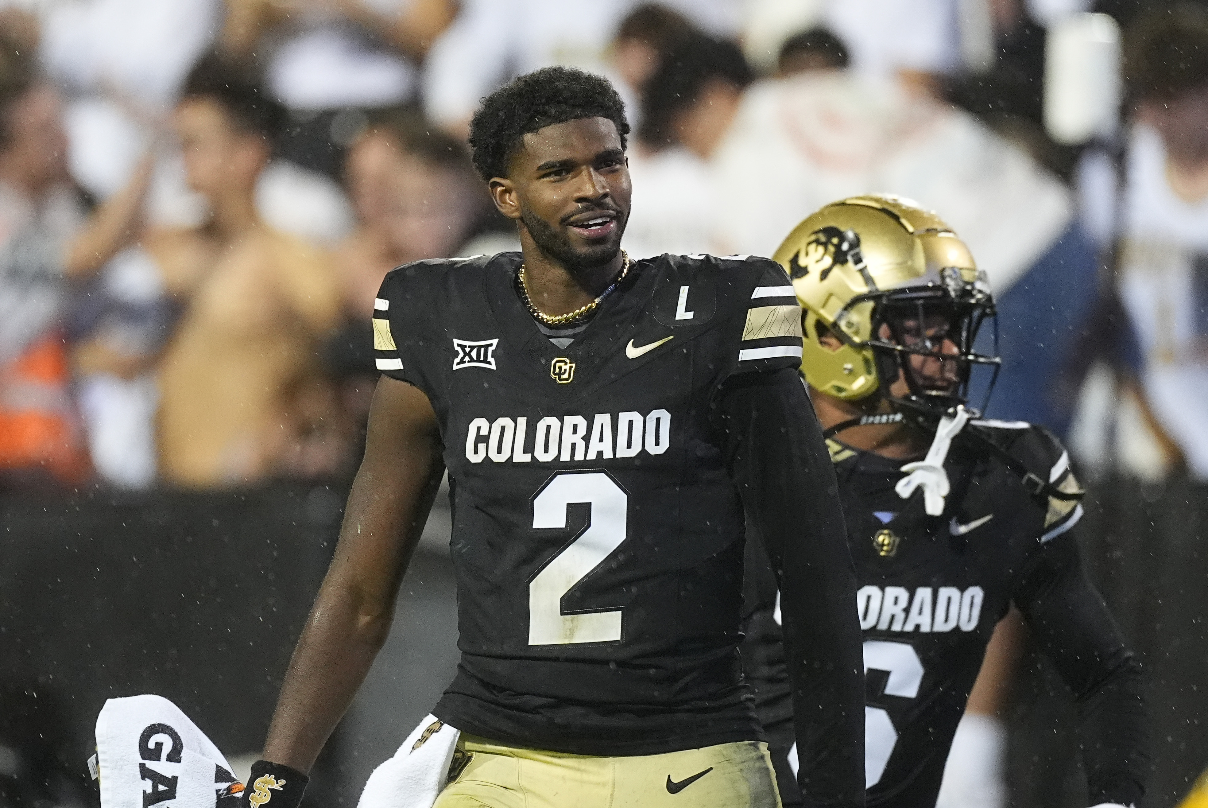 Colorado quarterback Shedeur Sanders, front, and wide receiver Drelon Miller celebrate after an overtime victory over Baylor in an NCAA college football game Saturday, Sept. 21, 2024, in Boulder, Colo. (AP Photo/David Zalubowski) (David Zalubowski)