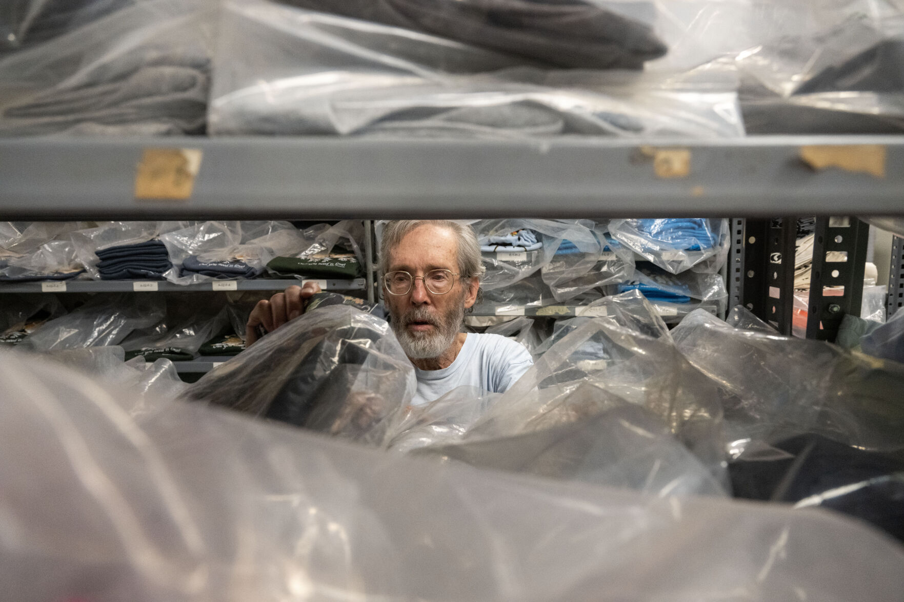 Jim Morris shows some of his favorite shirts at his shop in Boulder on Wednesday, Aug. 21, 2024. Morris has been running his environmental t-shirt company since 1976. (Stephen Swofford, Denver Gazette) (StephenSwoffordPhotographerstephen.swofford@gazette.comhttps://secure.gravatar.com/avatar/1ddcaf11c5d70eaa58546ddc4e038687?d=mm&r=g)