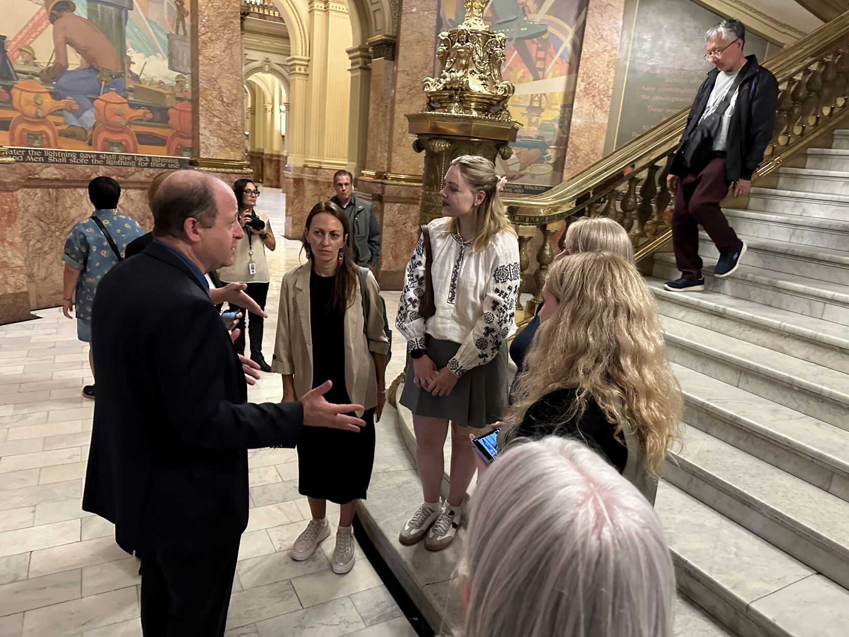 Gov. Jared Polis meets with the Ukrainian journalists in the state Capitol in Denver. (Evan Wyloge for the gazette)