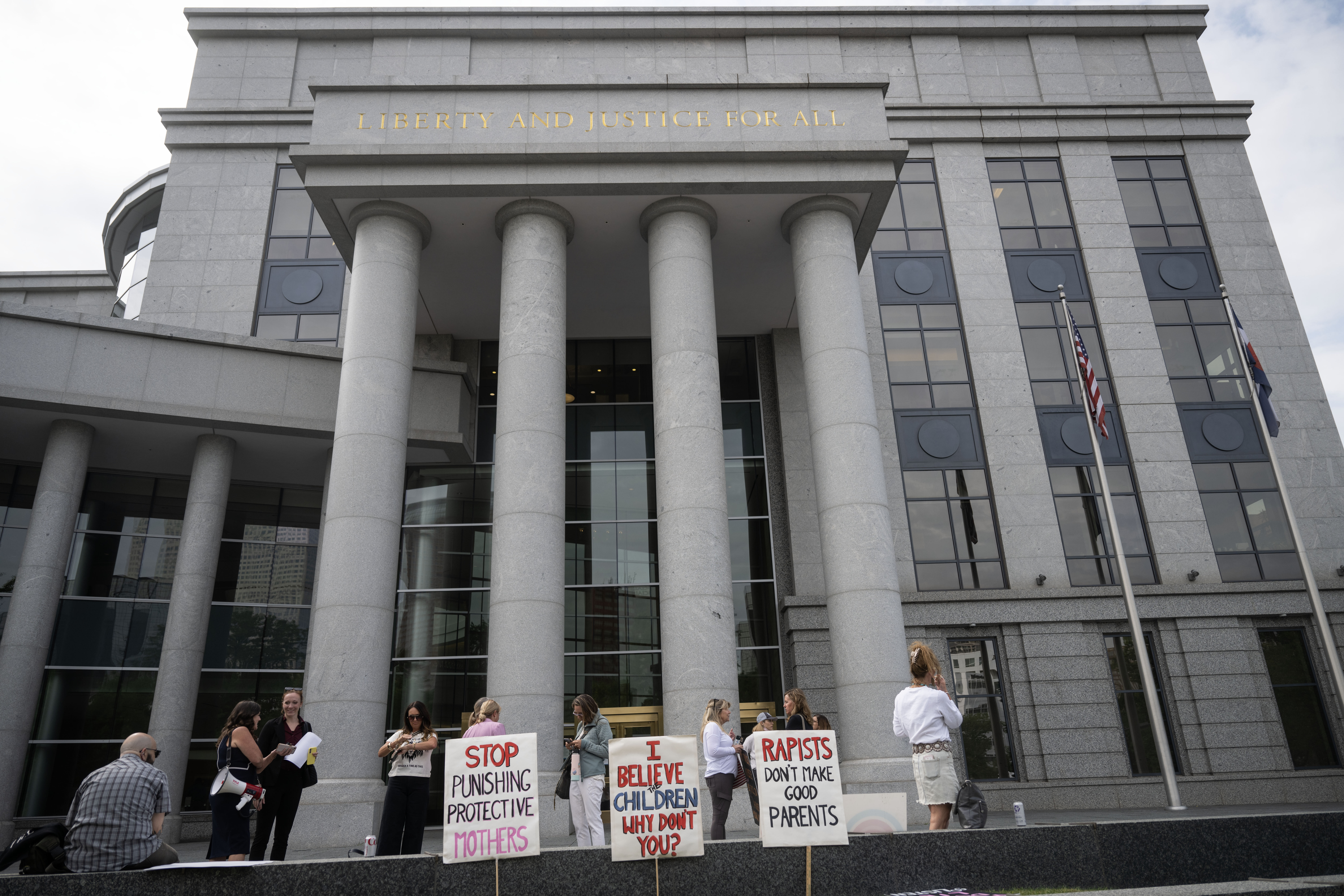 Women gather in front of the Ralph L. Carr Colorado Justice Center in Denver before the start of a rally calling for family court reforms on Thursday, Sept. 5, 2024. (Stephen Swofford, Denver Gazette) (Stephen Swofford Denver Gazette)