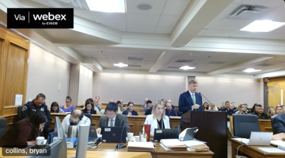 Ahmad Alissa, seen in a white shirt on the left, looks or draws on a piece of paper during witness testimonies during his murder trial on Tuesday. (Screengrab of the 20th Judicial District's live feed via WebEx)