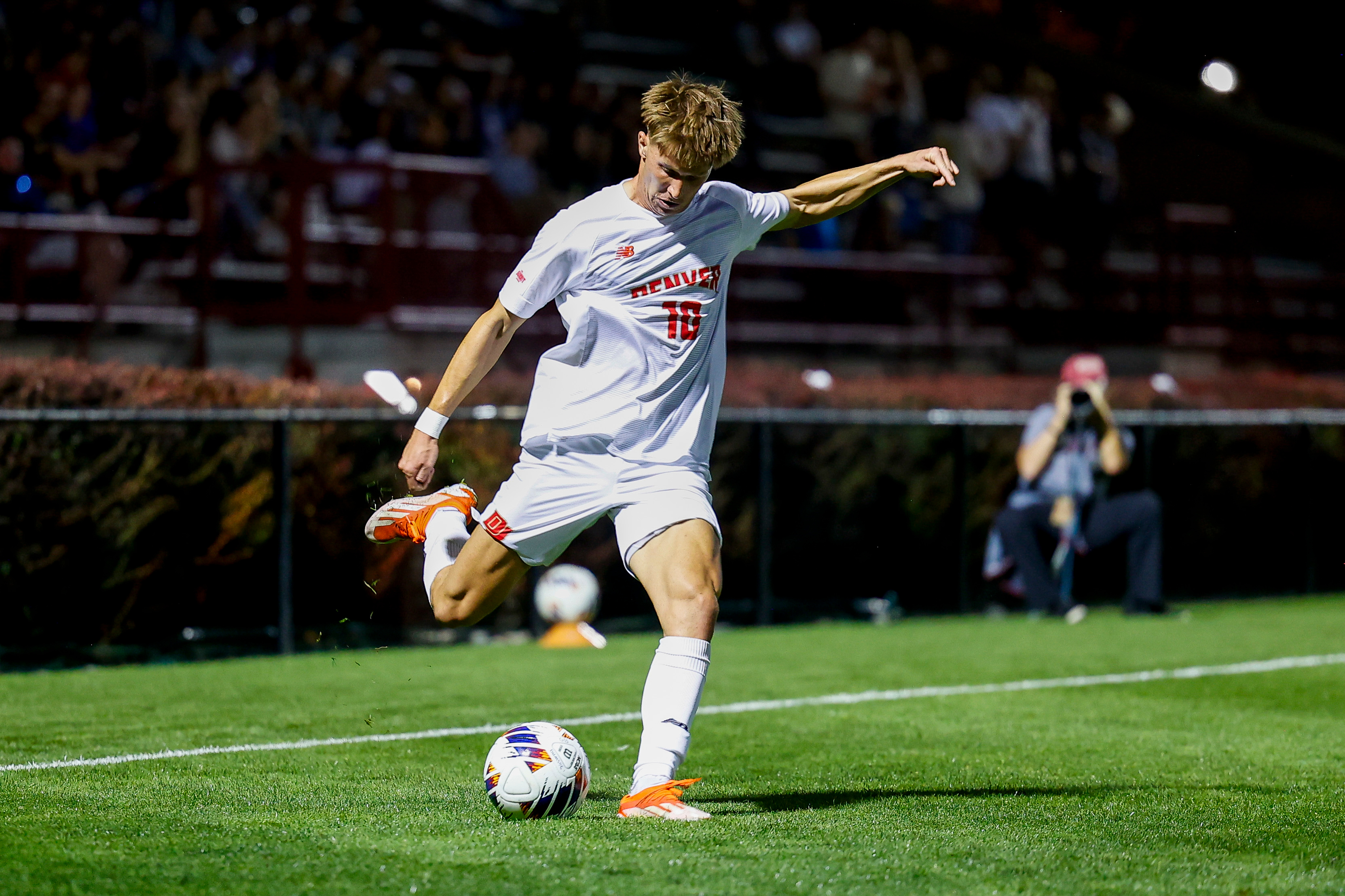 University of Denver midfielder Sam Bassett plays a cross during Thursday's match against Portland at Ciber Field. (Michael Ciaglo/Clarkson Creative Photography) (Michael Ciaglo/Clarkson Creative Photography)
