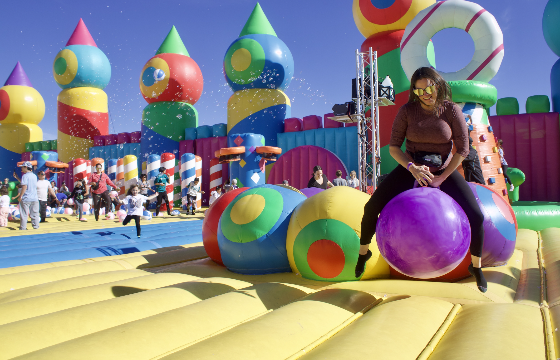 Adrienne Peros (right) jumps up on a inflatable ball while other kids and adults jump on a massive bounce house hosted by Big Bounce America Tour at the new National Western Center on Sunday, Sept. 22 in Denver, Colorado. (NoahFestensteinCity Government Reporternoah.festenstein@denvergazette.comhttps://denvergazette.com/content/tncms/avatars/9/f0/326/9f032698-379f-11ee-8053-8bacbed4931f.60984dba383441d9647e0e740a08a8e6.png)