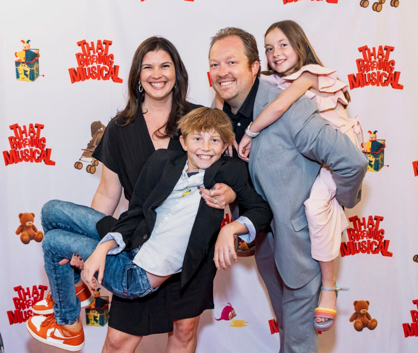 The Fuller family had plenty to celebrate when 'That Parenting Musical,' written by Kristina and Graham Fuller, opened off-Broadway on Sept. 12, 2024, in New York. They are joined by their children, Daniel and Sophia. (REBECCA J. MICHELSON)