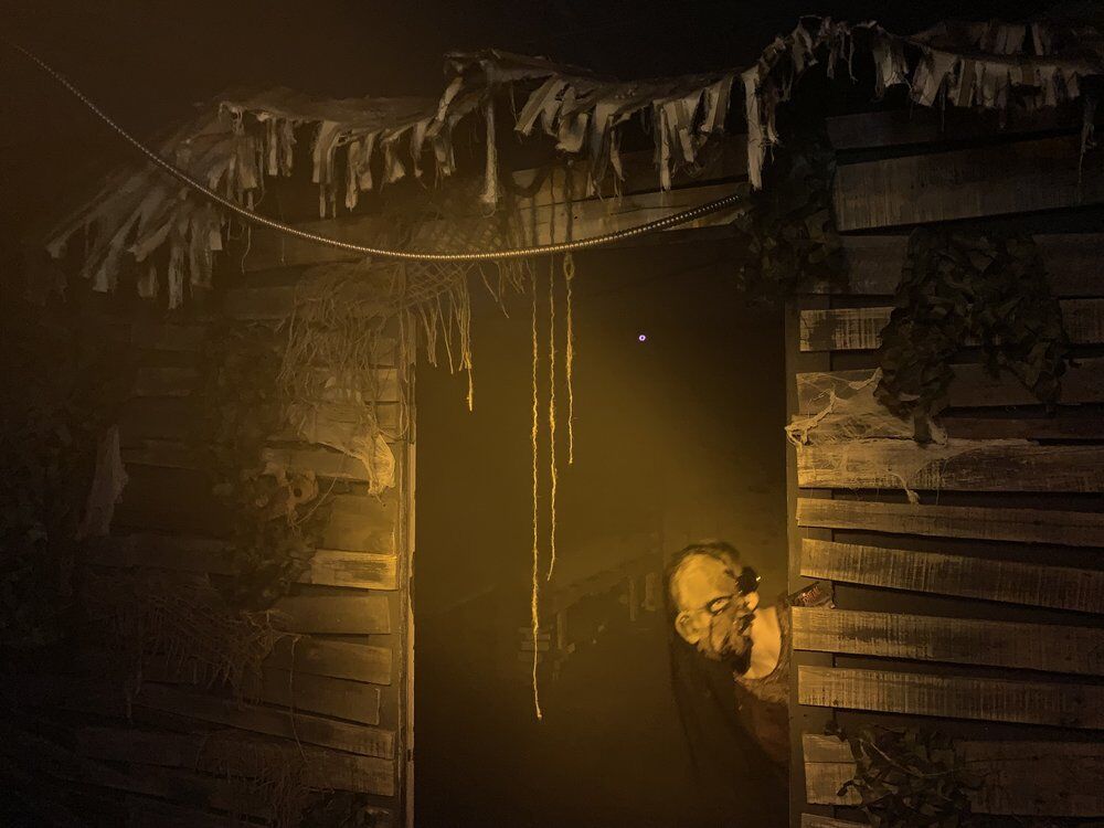 A monster peaks his head behind a wall at The Ritual Haunted House in Englewood, Colorado. (Courtesy photo, The Ritual Haunted House)