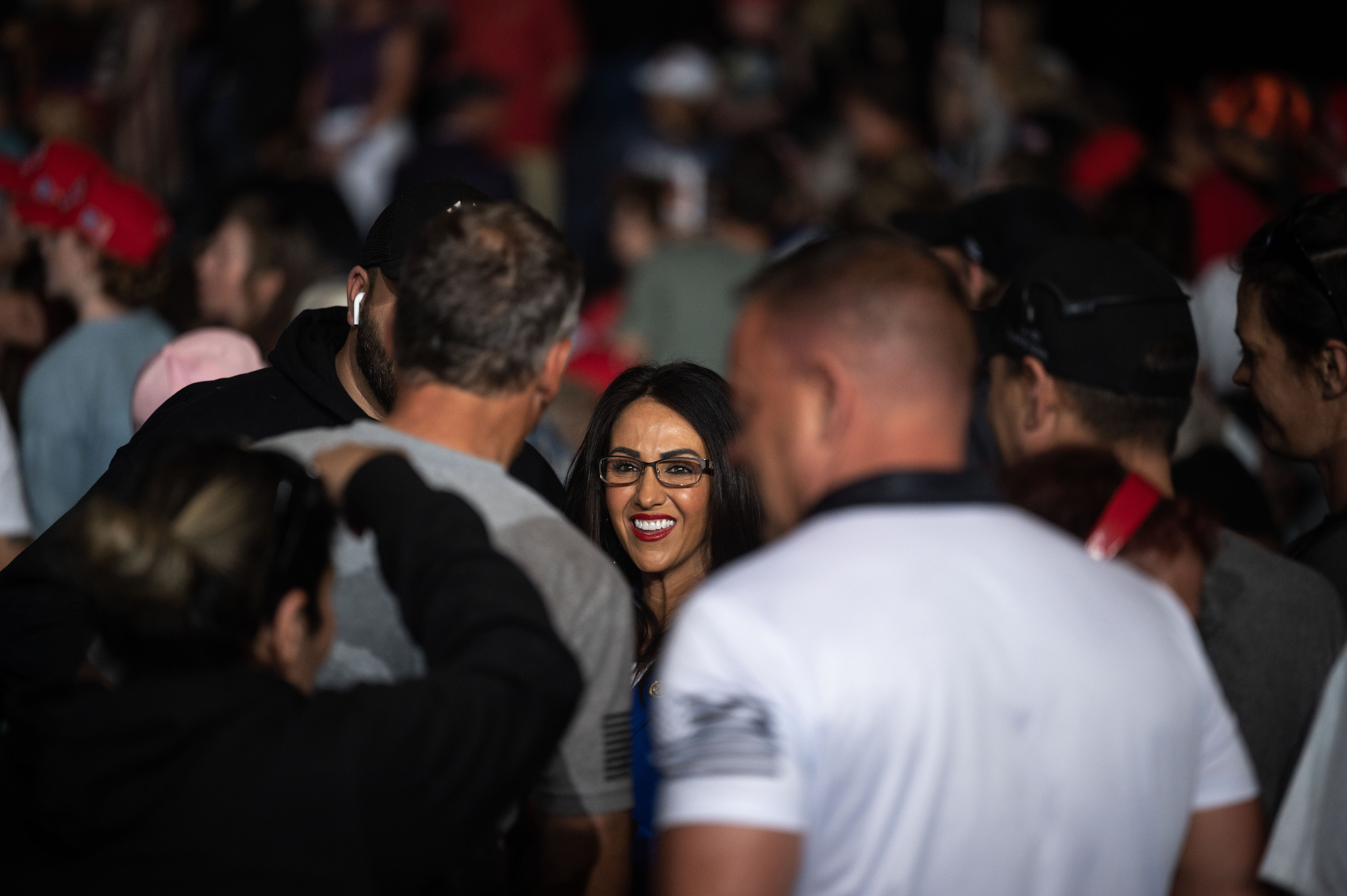 Lauren Boebert takes photos and signs memorabilia for fans as they wait for Donald Trump to take the stage during a trump rally at the Gaylord Rockies Resort and Convention Center in Aurora on Friday, Oct. 11, 2024. (Stephen Swofford, Denver Gazette) (Stephen Swofford Denver Gazette)