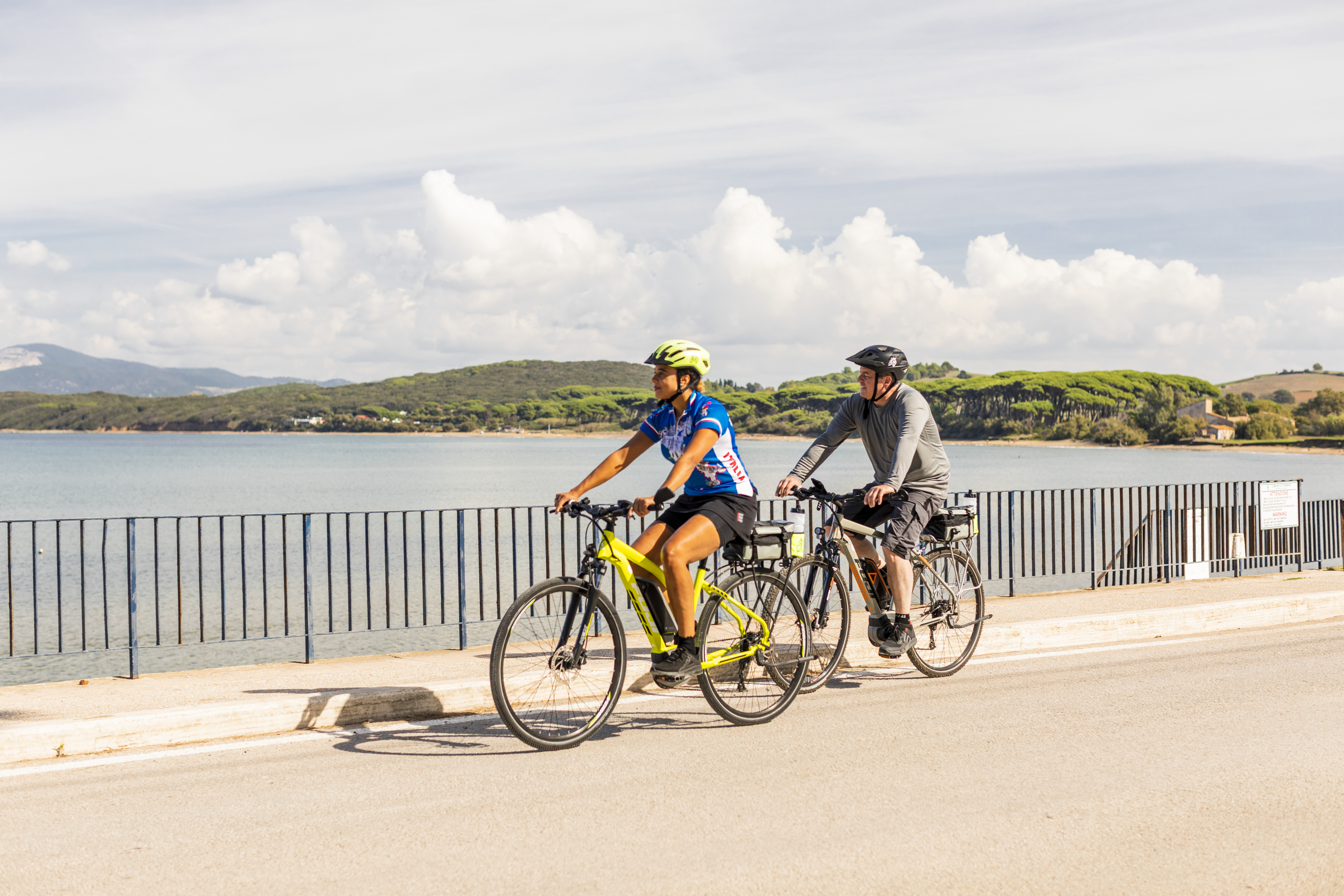 VBT Tuscany Couple Biking on Boardwalk