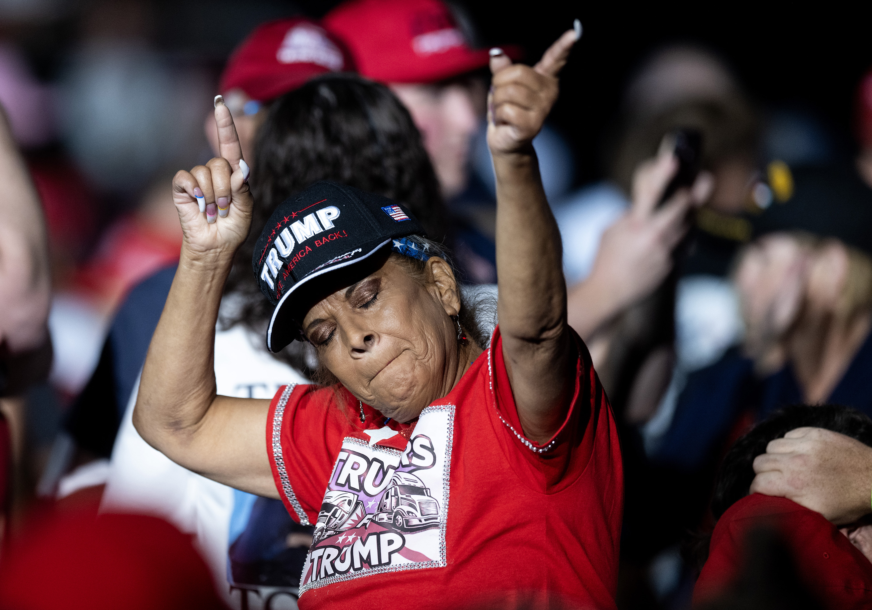 A woman dances to “YMCA” at a campaign rally for former President Donald Trump at the Gaylord Rockies Resort and Convention Center, Friday, Oct. 11, 2024, in Aurora, Colo. (Parker Seibold, The Gazette)