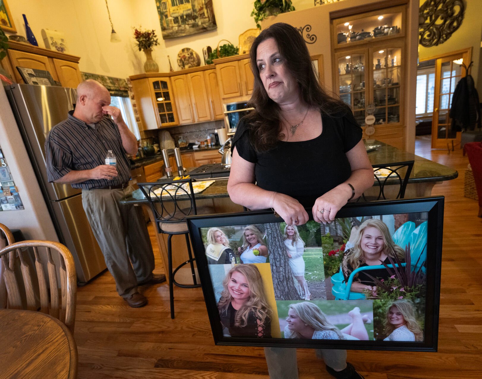 Colleen Foster holds a collage made from pictures of her deceased daughter, Cailin Foster, while her husband, retired Air Force Lt. Col Gary Foster, stands in the background last month in their Monument home. Cailin died by suicide on Nov. 7, 2021. She was sexually assaulted while at the Air Force Academy and lost her boyfriend and fellow cadet to suicide. (Christian Murdock, The Gazette)