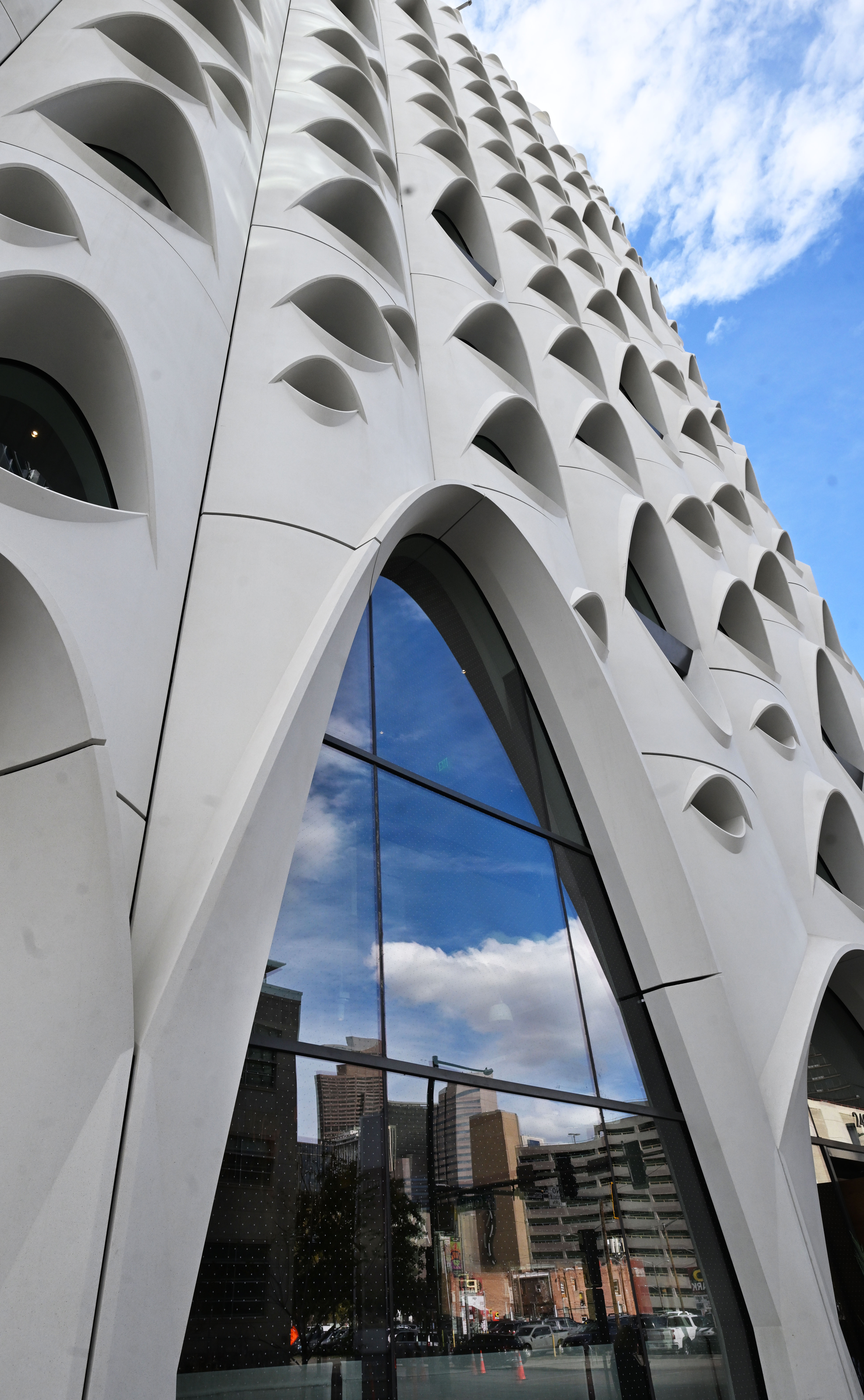 The skyscrapers of Denver are reflected in the windows of the Populus Hotel. The windows are designed to be like the 