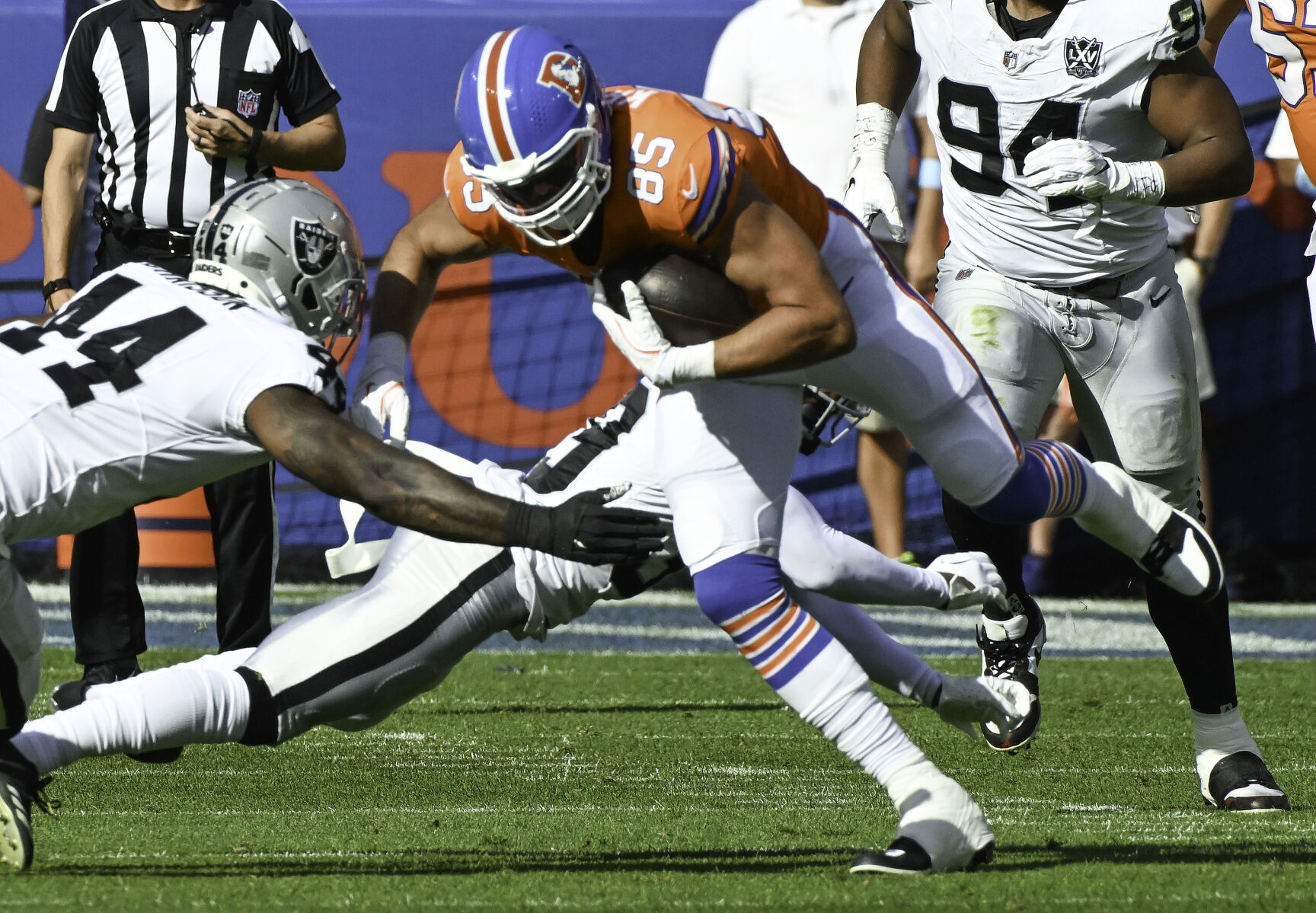 Denver Broncos tight end Lucas Krull (85) advances the ball after making a catch during the second quarter of a game at Empower Field at Mile High on Sunday, Oct. 6, 2024. The Broncos won the game 34-18. (Jerilee Bennett, The Gazette)