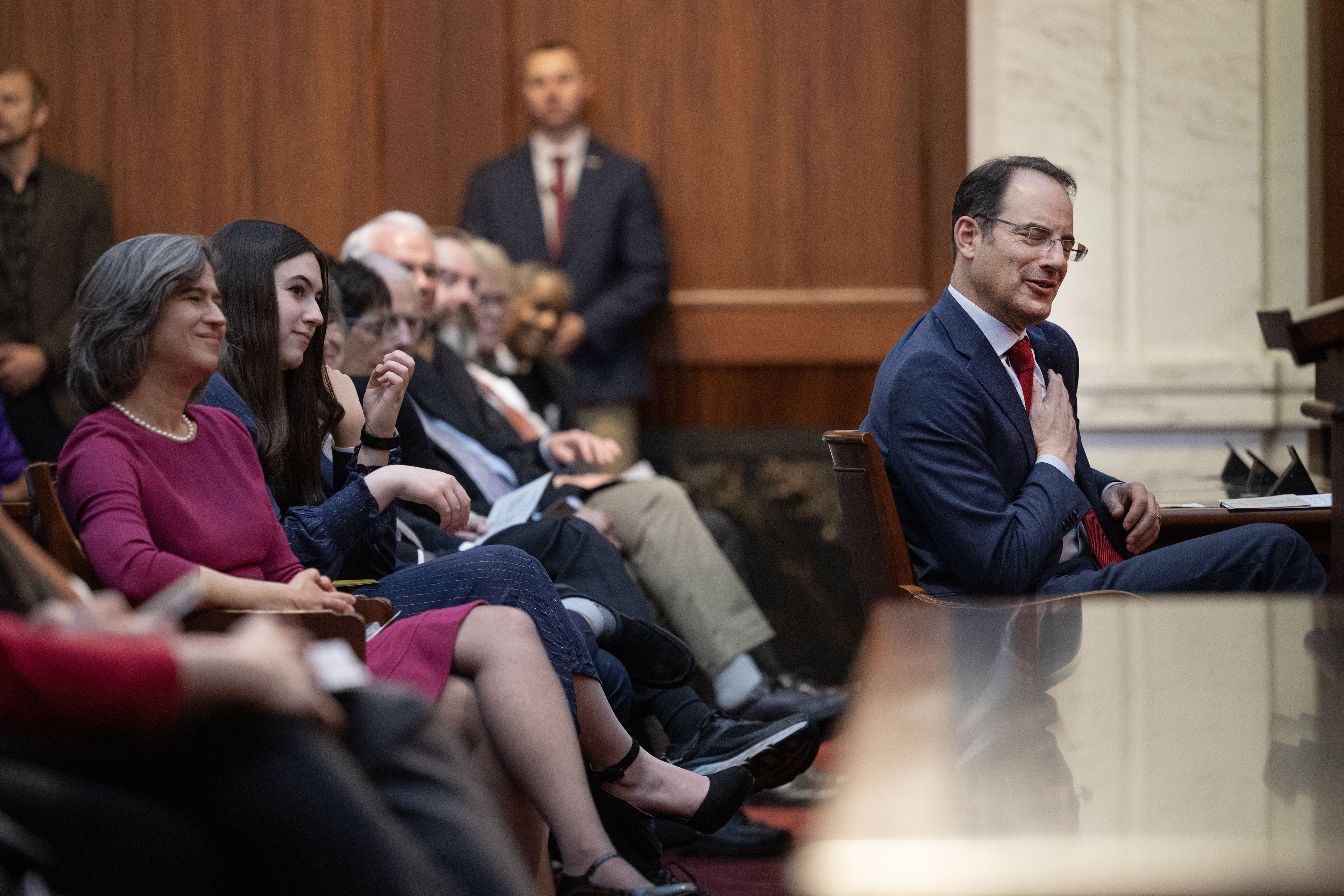 Colorado Attorney General Phil Weiser reacts during a speech by Colorado Supreme Court Justice Monica Marquez during the investiture ceremony for Weiser’s second term in the Supreme Court chambers on Jan. 12, 2023, in Denver. (TimHursttim.hurst@gazette.comhttps://secure.gravatar.com/avatar/aca82bd62b4ee425c598527cd6faa1b1?d=mm&r=g)