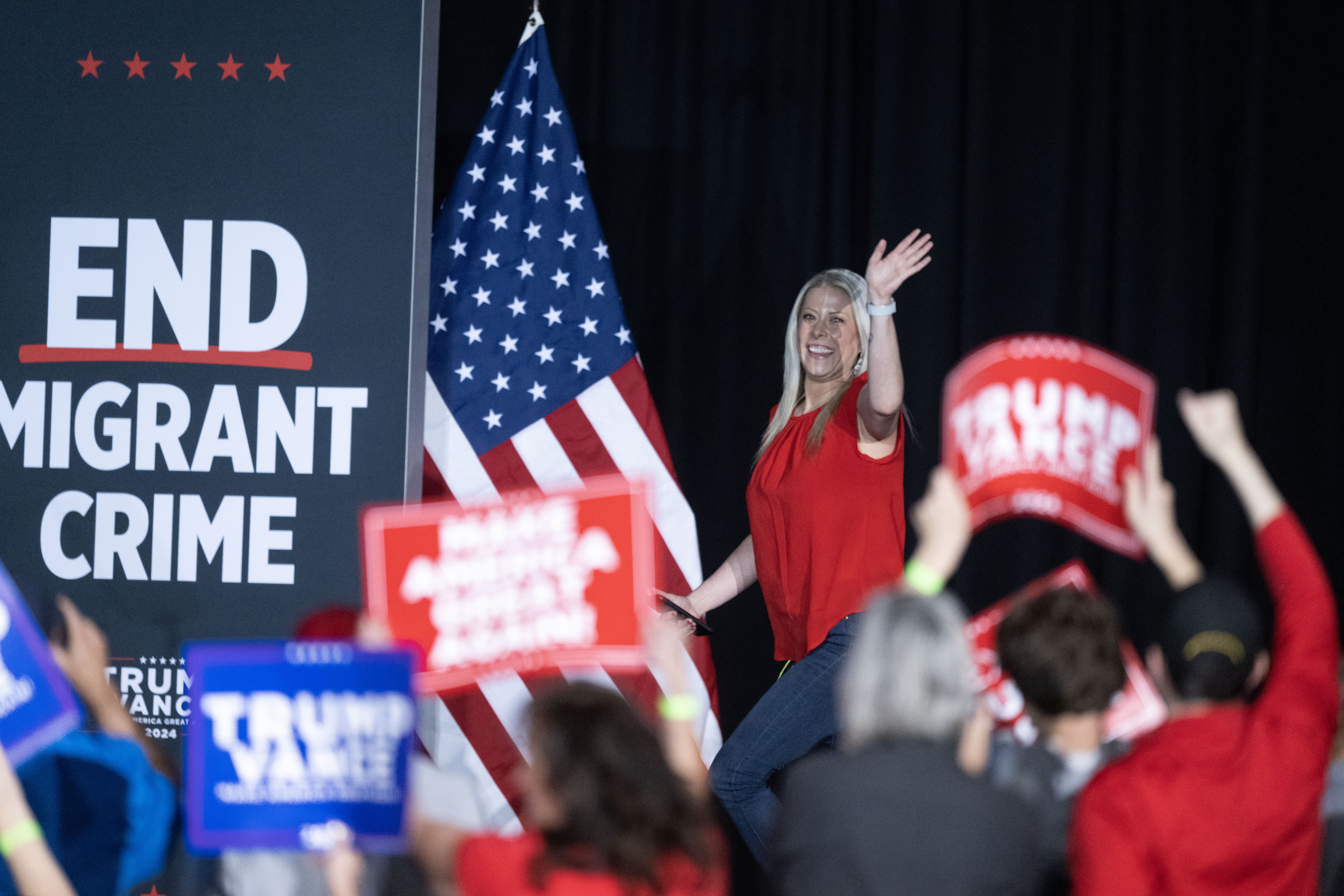 Aurora Councilmember Danielle Jurinsky waves to the crowd as she takes the stage during a trump rally at the Gaylord Rockies Resort and Convention Center in Aurora on Friday, Oct. 11, 2024. (Stephen Swofford, Denver Gazette) (Stephen Swofford Denver Gazette)