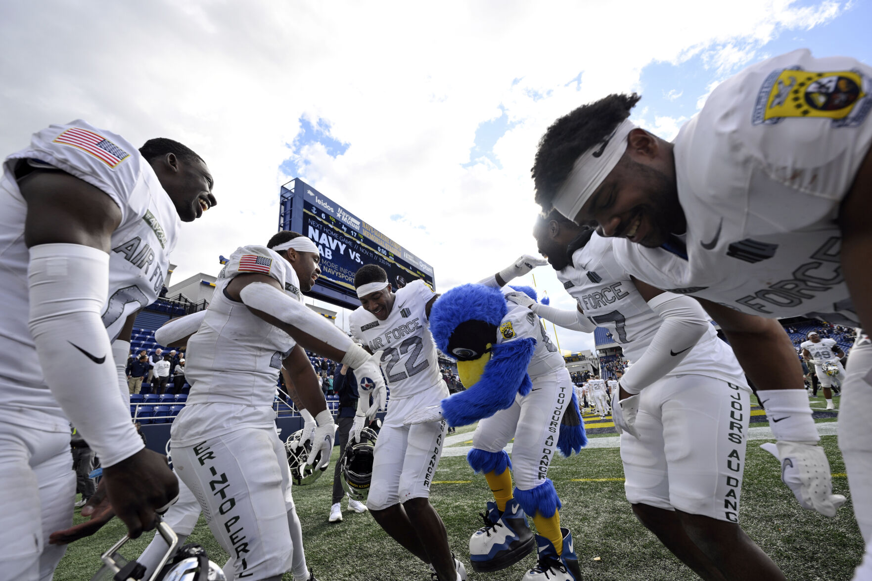 Air Force players and mascot dance on the sideline after defeating Navy on Saturday in Annapolis. (Photos by the associated press)